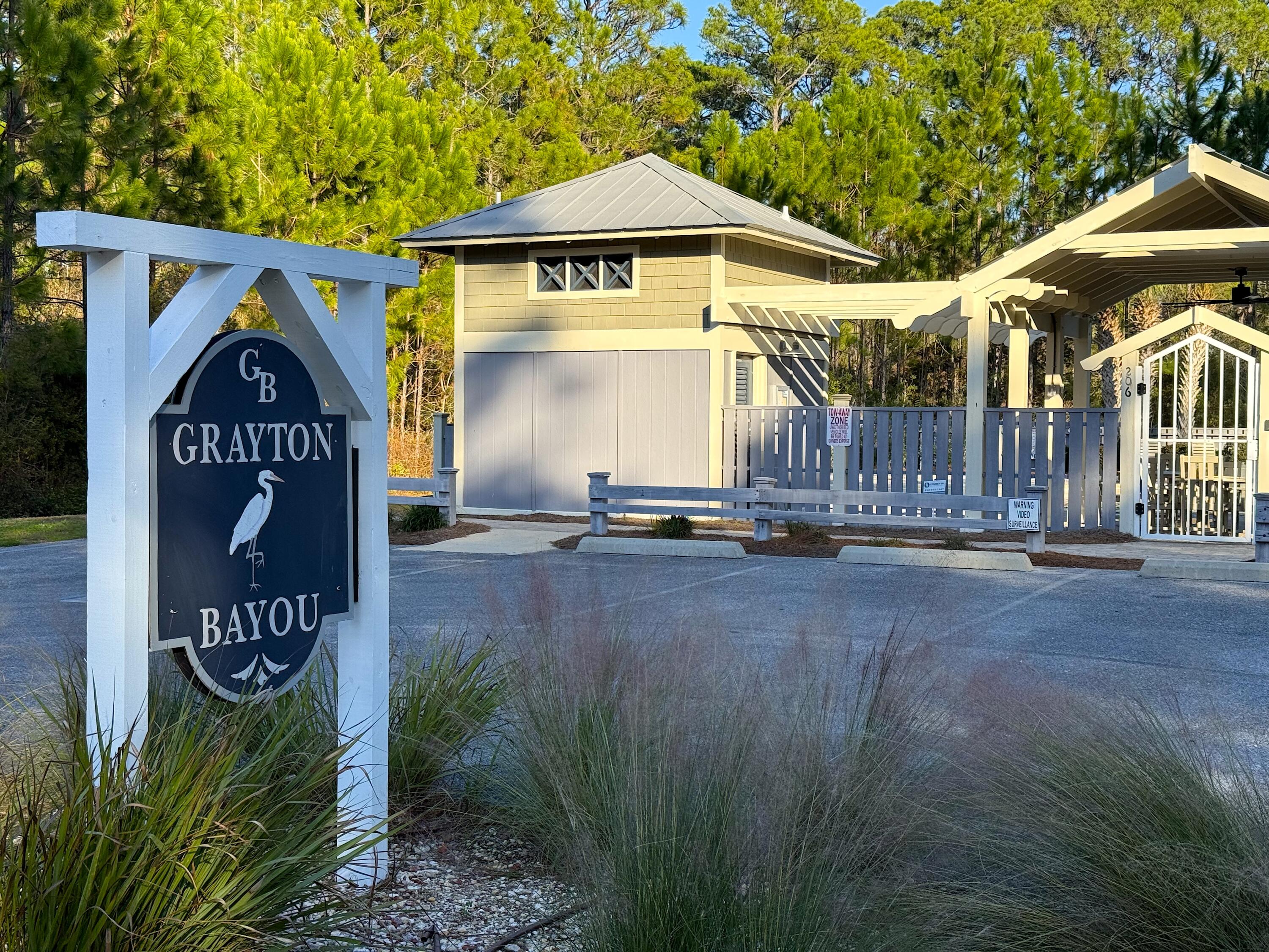 Grayton Bayou is located only 5 minutes north of Grayton Beach. Pt. Washington State Forest views across the street. These streets are lined with Palm Trees & Oak's.   This homesite has the Private Drive / Alleyway access.. This homesite is one of the ''full size'' homesites and has room for a main house and a carriage house.  Grayton Bayou min. house size at least 1600 sq. ft. with a florida cottage design. Grayton Bayou requires 6 month or more for rentals. This neighborhood has a large swimming pool with waterfall, boat launch at end of Riker Ave., bay front park on E. Mitchell. Property is beautiful and wooded, new homes being built all around. Sold 'AS IS''