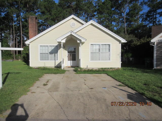 Welcome to this charming Fort Walton Beach cottage—a cozy, single-story home designed for comfort and convenience. Inside, vaulted ceilings soar through the living room and bedrooms, creating a bright and open feel. The living area features a warm wood-burning fireplace and a blend of laminate and carpet flooring. The galley-style kitchen offers generous cabinetry and efficient design, perfect for everyday living. Each bedroom includes its own private bathroom, making the layout ideal for guests or roommates. Step outside to a spacious backyard with room to relax, play, or entertain. A convenient driveway provides easy parking. A sweet Florida retreat just minutes from everything Fort Walton Beach has to offer.