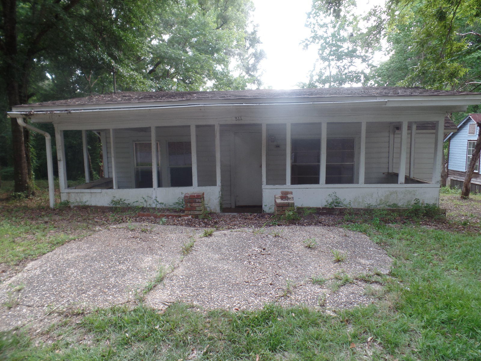 Investors wanted!! All this house needs is some TLC, has tons of potential and preserved character. Owner has 3 adjoining properties and is willing to sell together. Property is being sold ''as is.'' Buyer must verify all square footage.
