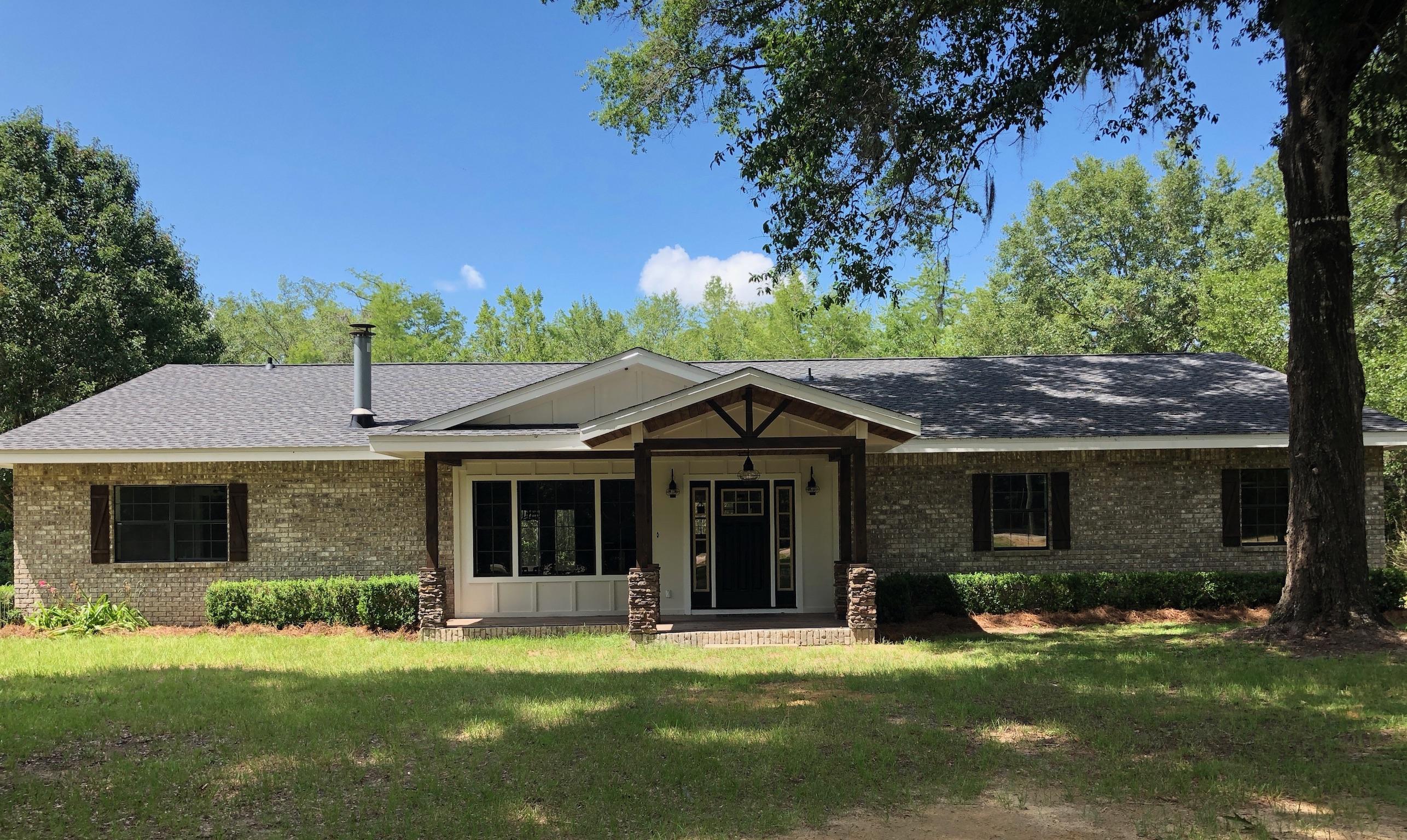 Price Reduced: Beautiful waterfront remodeled home with over 2500 sq ft sits on 2 lots in the private Blue Pond Community. From the the newly redesigned exterior to the grandeur of the interior, you will fall in love. Current owners have taken this home to a new level. Open floor plan with custom kitchen that your cook will flip over. Kitchen features distressed farmhouse sink cabinet overlooking lake, custom cabinetry with soft close hinges, distressed pantry & stove hood, custom island, two level bar and new stainless steel appliances. Master bedroom features french doors leading out to expansive screened back porch so you can enjoy the view of the lake. Adjoining vacant lot can be purchased with home for $335,000 or vacant lot 25A without home for $47,00. See Document section Updates completed in 2018 include: (see document section for complete detail and survey)

Exterior Upgrades - New roof, new hardi board siding on front porch and gables, new solid core exterior doors, new windows with rustic shutters, new wood look tile flooring on front and back porches, open rafter gable ceiling with tongue and groove wood ceiling, stone accent columns, vinyl ceiling on back porch. 

Interior Upgrades - Timberland engineered luxury vinyl plank flooring throughout, complete kitchen remodel, new drywall in wet areas and drywall refinished throughout remainder of home, new custom lighting in every room, 2 new Rheem heat pumps (14 SEER 3 ton and 1.5 ton with 10 yr manufacturer warranty), Rheem energy efficient 50 gallon water heater, all new appliances with 5 year manufacturer warranty, updated fireplace by adding new ledgestone and hearthstone and features reclaimed sinker cypress mantel from a tree harvested from Choctawhatchee River, new solid core interior shaker style doors, solid core sliding shaker style barn doors in master, new custom designed master bathroom with custom built vanity with distressed wood, trough sink and designer double faucets with pedestal tub and custom built frames glass shower, custom guest bathroom vanity with farmhouse sink and shower/tub combo, new toilets with soft close lids, new laundry room with storage area, pull down stairs for attic access. 

Property also features great walkout deck to lake. Home sits on lots 25B and 25C and Lot 25A is vacant. This is a rare opportunity to own prime real estate in the Blue Pond Community.
