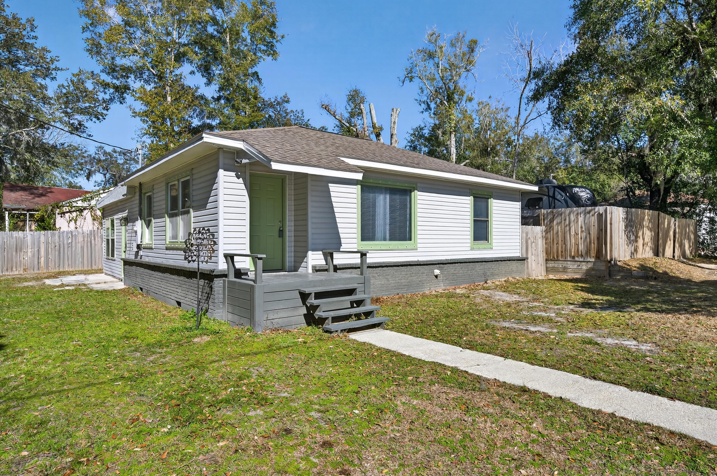 Full of charm and character, this home is ideally located in the heart of Milton, just minutes from downtown and surrounded by everyday conveniences and local favorites! Enjoy close proximity to gems like Milton Bakery and Boomerang Pizza, easy I-10 access, four nearby boat ramps all within 10 minutes (2 being Marquis Basin boat ramp and Russell Harber boat ramp), and only 25 minutes to Navarre Beach. With no HOA, and RV and boat parking allowed, this property also offers a unique income opportunity thanks to a fully gated adjacent lot, perfect for RV or boat storage. The home has been updated throughout and features a brand-new water heater (2026) and hurricane shutters (2026). The inviting living room showcases charming built-ins, while the kitchen features crisp white cabinetry and wh ite appliances for a clean look. The primary suite is tucked away on its own side of the home and offers an updated en suite bathroom with a tiled walk-in shower and new vanity. Two additional bedrooms and a full bathroom are located on the opposite side of the home, with cozy carpeted flooring and a tub/shower combo. Outside, the corner lot allows for ample parking and includes a fully fenced backyard with a privacy fence. A converted garage provides additional utility or storage space and is equipped with a fan, adding even more flexibility to this versatile property. This inviting property is a wonderful opportunity to enjoy a well-located home with flexibility and room to make it your own!