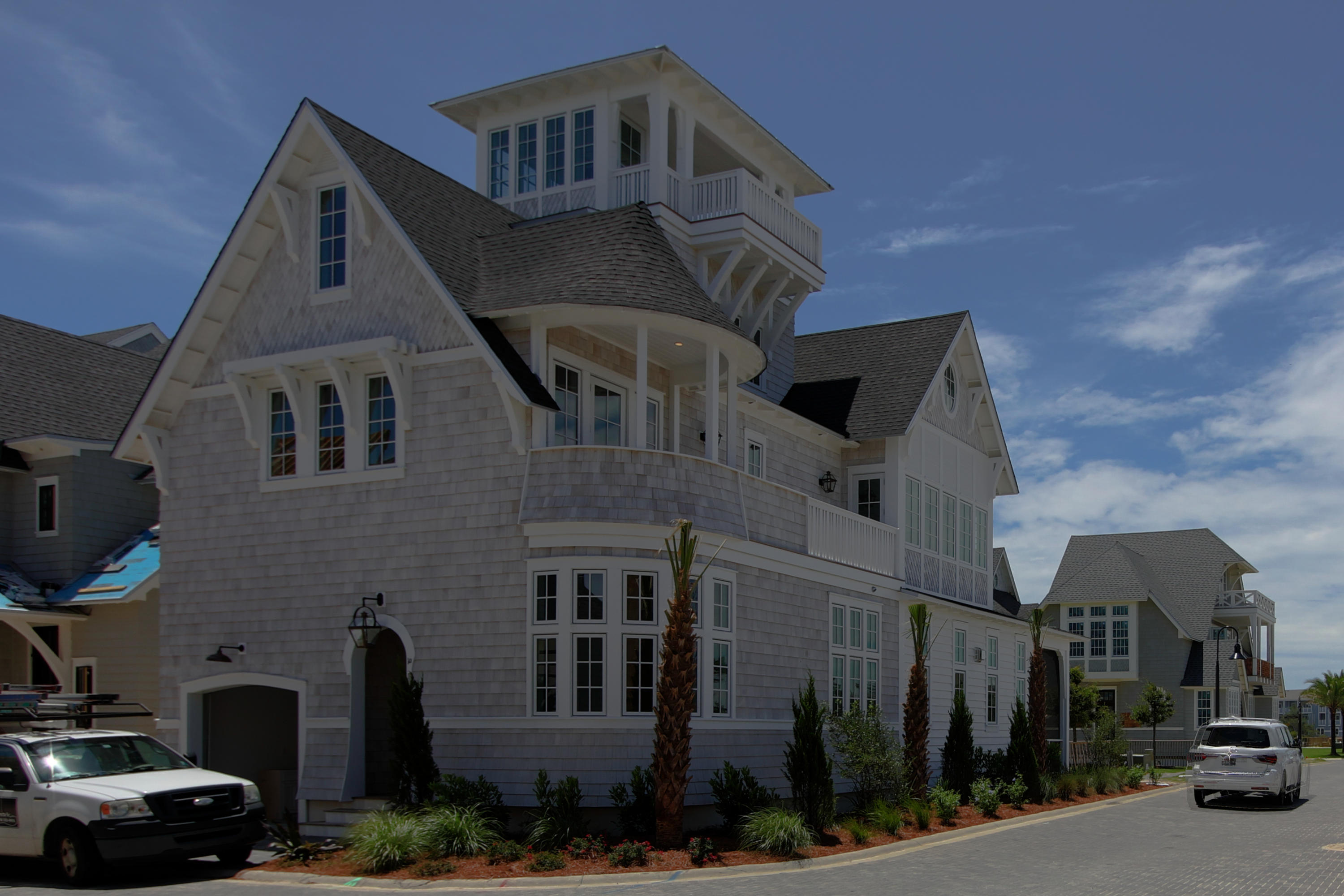 Designed by well-known architect Rick Lowe, this 4 bedroom, 5-1/2 bath home offers grand living in the magnificent setting of Grace Point on 30A. Boasting a balanced blend of coastal chic, wood tones, the layout, and flow of the home is both welcoming and timeless for friends and family to enjoy. Upon entry to the residence, the overhead hand-hewn beams will captivate your attention, as you step onto the warm hardwood flooring, your eye is drawn to the shiplap & tile clad fireplace creating a dramatic and cozy statement.
The gracious great room offers seating for family gatherings and entertaining and the outdoor living becomes seamless with large doors opening to the wide screened-in porch. Surrounding the large center island, Subzero and Wolf appliance packages offer the perfect complement for a holiday feast or neighborhood get-together. The kitchen is topped off with tall custom cabinets offering ample storage and stunning Quartz countertops. Each bedroom offers a retreat from your long days at the beach with spa-like baths for refreshing the body and soul while surrounded by Carrera marble countertops and tile backsplashes. 
Notable features of the home include: 3rd-floor bunk room that sleeps 12, secondary family room, laundry room, oversized porches, and a 4th-floor tower to watch the sunrise or sunset over the Gulf of Mexico.
Life at Grace Point provides owners with an opportunity for a Lifestyle Membership to Clubs by Joe. Simply step off the front porch and walk through the manicured park to the private gated access to WaterSound Beach Club and the Coastal Dune walkovers to the pristine private beaches, or head over to Camp Creek and Sharks Tooth for a day on the Links. Later that evening, bike or walk along the pedestrian path to the HUB on 30A for shopping, food, live entertainment and endless family fun.