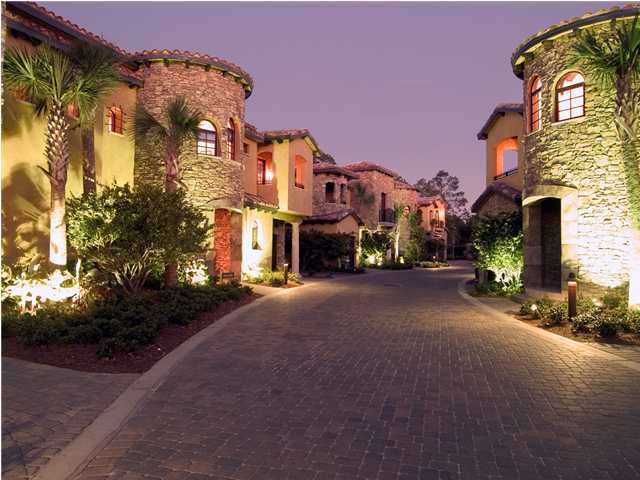 This Tuscan themed townhome is sure to impress with its Italian design and charming interior featuring tile roofs, turrets, stone work, washed stucco, exposed rafters and beams. Other features include Viking appliances, granite countertops, stone fireplace, travertine floors, custom woodwork, private courtyard with outdoor kitchen, and beautiful wine cellar. Truly a must see home. Come see what all a Resort Community has to offer. Amenities available with the lease of this home (for a one-time, $150 administrative fee per lease term) are daily kayak, bike and boogie board rentals, daily tennis court time, fitness club access (with spa and steam rooms), access to the resorts four pools, and discounts on golf and beach set-ups.