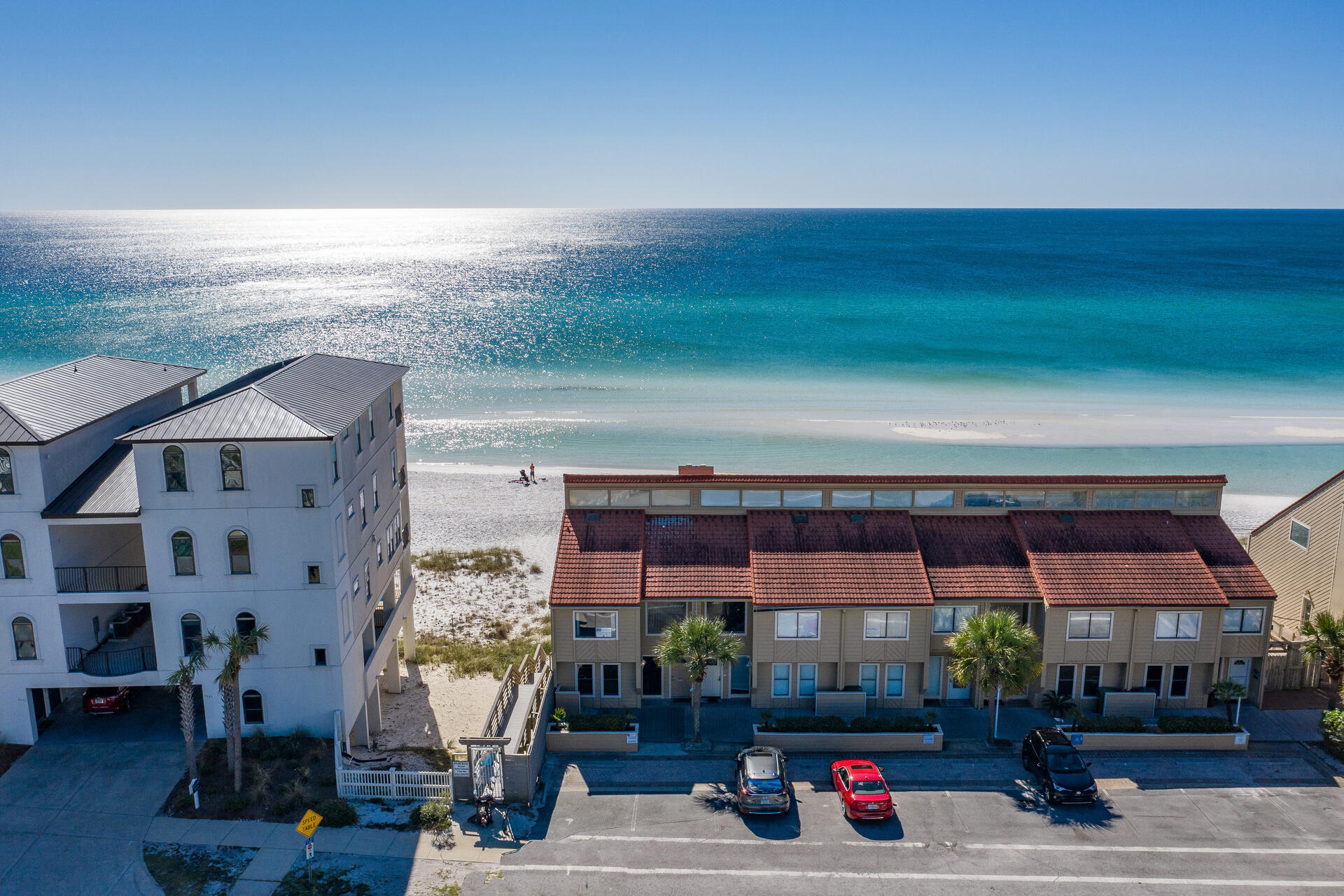OWN YOUR PERSONAL PIECE OF PARADISE DIRECTLY ON THE SAND WITH PRIVATE BEACH & SECURITY GUARD & >180K PROJECTED NET 2021 INCOME!  As opposed to other properties that offer private 'beach access', this home includes your own EXCLUSIVE, PRIVATE BEACH from corner to corner of deck down to walkway in front water for ONLY owners & their guests. A GIANT 34x21 new deck adjoins your private beach.    W/stunning Gulf views from almost every room, live the beach front lifestyle you've always dreamed of. New to the rental market June 1, this power house GENERATED, during Covid > 106K NET rental income, AFTER taxes & cleaning were paid, in just 6 months (WITH REDUCED RATES) & has estimated annual NET projections >180K! Similar sized condos, older & dated, in Green Reef have verifiable 150K+ income. Offering 5 bedrooms, 2 kitchens, several large indoor living areas & lots of outdoor living areas, this Home is perfectly designed to accommodate LARGE groups & maximize rental income.   Escape to your own oasis, a spacious master bedroom w/ vaulted ceiling & large 20x10 balcony. The 3rd level also has second bedroom w/en suite bathroom and a 3rd full bathroom to service an additional future bedroom if added.   The ocean level with 2nd living area, kitchen & 2 more bedrooms, flow effortlessly onto the GIANT 34x21 covered & open patio area with your own private walkway directly onto to your own private beach.  Ideally located in the heart of Destin, this fabulous home is close to fine restaurants, shopping, golf & tennis.