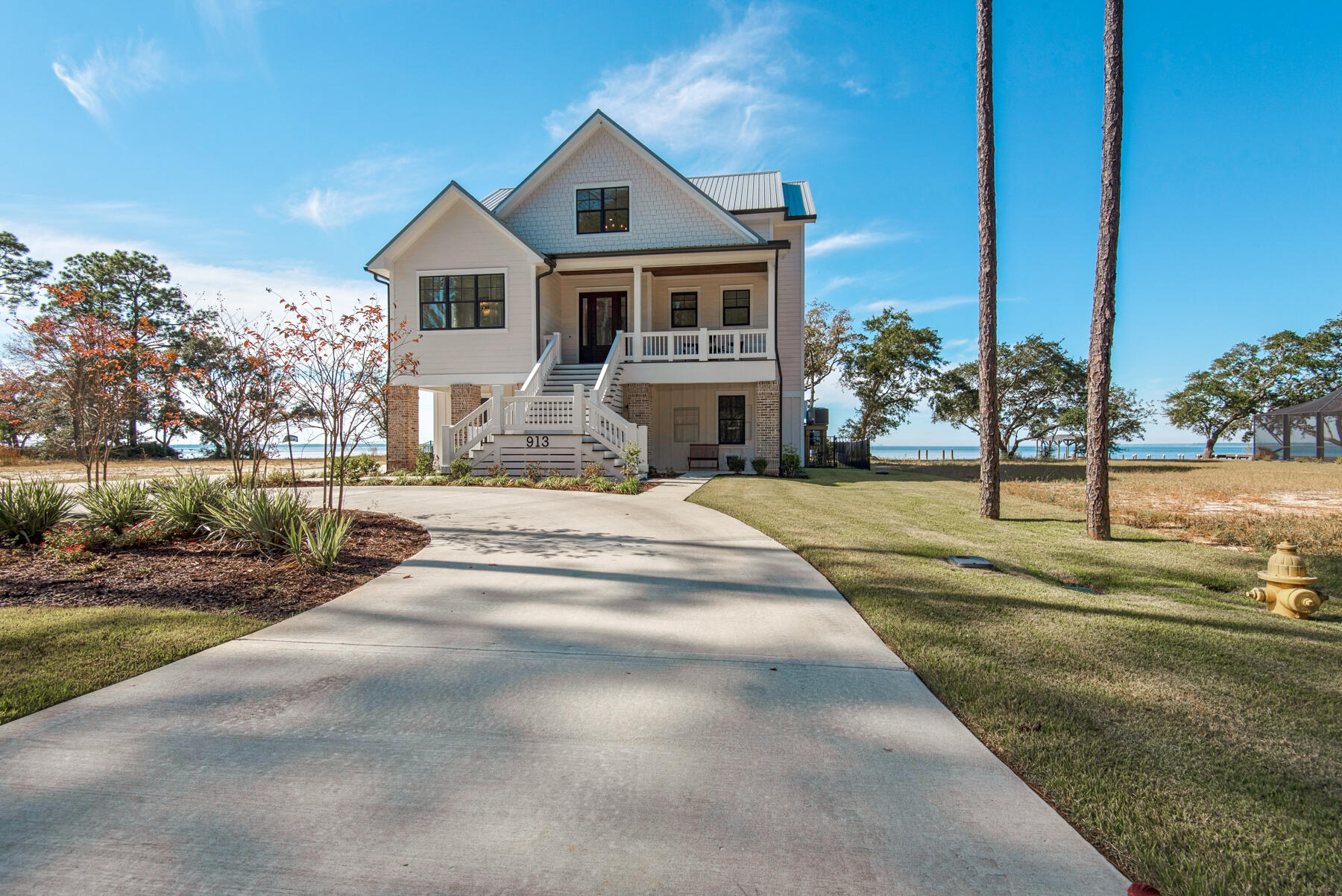 Enjoy living the Bay life in Bay Harbour! This quiet bayfront neighborhood is Freeport's best kept secret. There are no words to describe the sunsets you will experience here! 
This custom built home offers just over 3300 sf of living space with 4 bedrooms and 3.5 baths. The bedrooms are spacious and all have a view. Just the right amount of shiplap and reclaimed brick in the main living areas provide the charm that is so desirable. 
Outdoor areas are a must for waterfront living. You will find an outdoor kitchen, pool with hot tub and gas fire pit. Not to mention the dock with boat house and lift that make it so easy to hop in your boat and head out to Crab Island or for a sunset cruise.
This home is a must see as there are too many extras to list!
