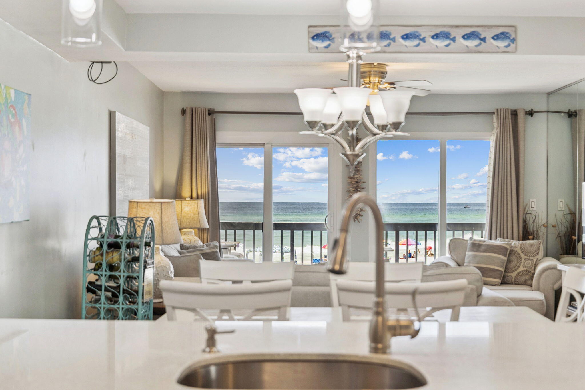 Enjoy direct Gulf-front living in this updated 2-bedroom, 2-bath condominium located in the gated community of Pinnacle Port on the west end of Panama City Beach. This residence offers unobstructed views of the coastline from the main living area, private balcony, and both bedrooms.

The interior features an open-concept layout with a well-appointed kitchen, complete with stainless steel appliances and solid surface countertops. The living and dining areas provide ample natural light and seamless access to the private balcony overlooking the Gulf. The primary suite includes a king bed, en-suite bath, and water views. The second bedroom also features a king bed and is adjacent to a full bath. Additional sleeping accommodations are available with a queen-size sleeper sofa in the main living space.

Pinnacle Port is a gated community offering a wide array of amenities, including two swimming pools (one seasonally heated), tennis and shuffleboard courts, a fitness room, saunas, playgrounds, and grilling areas. Residents and guests also have access to a boat launch and slips on Lake Powell, along with kayak and canoe rentals. The property is located near Camp Helen State Park and is a short drive to shopping, dining, and recreational options at Pier Park and 30A.

This condo is offered fully furnished and has been maintained for both comfort and functionality. Buyer to verify all measurements and details.