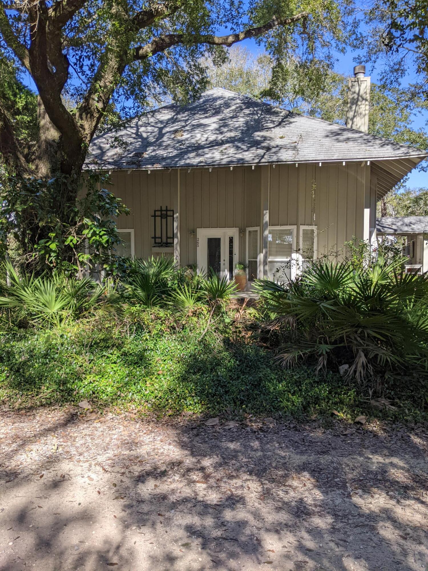 Perfect Seagrove 5th addition location. Beautiful wooded 1/4 acre lot. Ample room for additions if desired. Short distance to Seaside and our beautiful gulf beaches. Grocery store very close. Short distance to highway 98 that will take you to Destin or Rosemary Beach area. This home was built in 1992 has 3 bedrooms with 2.5 baths. Master suite on first level with 2 bedrooms on 2nd level. Open Great room with fireplace as you walk in front door. Screened in back porch with an additional open porch with hot tub. Smaller garage that could be used as workshop or golf cart parking. Ample yard with natural flora could be kept as such or built upon. Very convenient location tucked away off 30A in historic Seagrove.