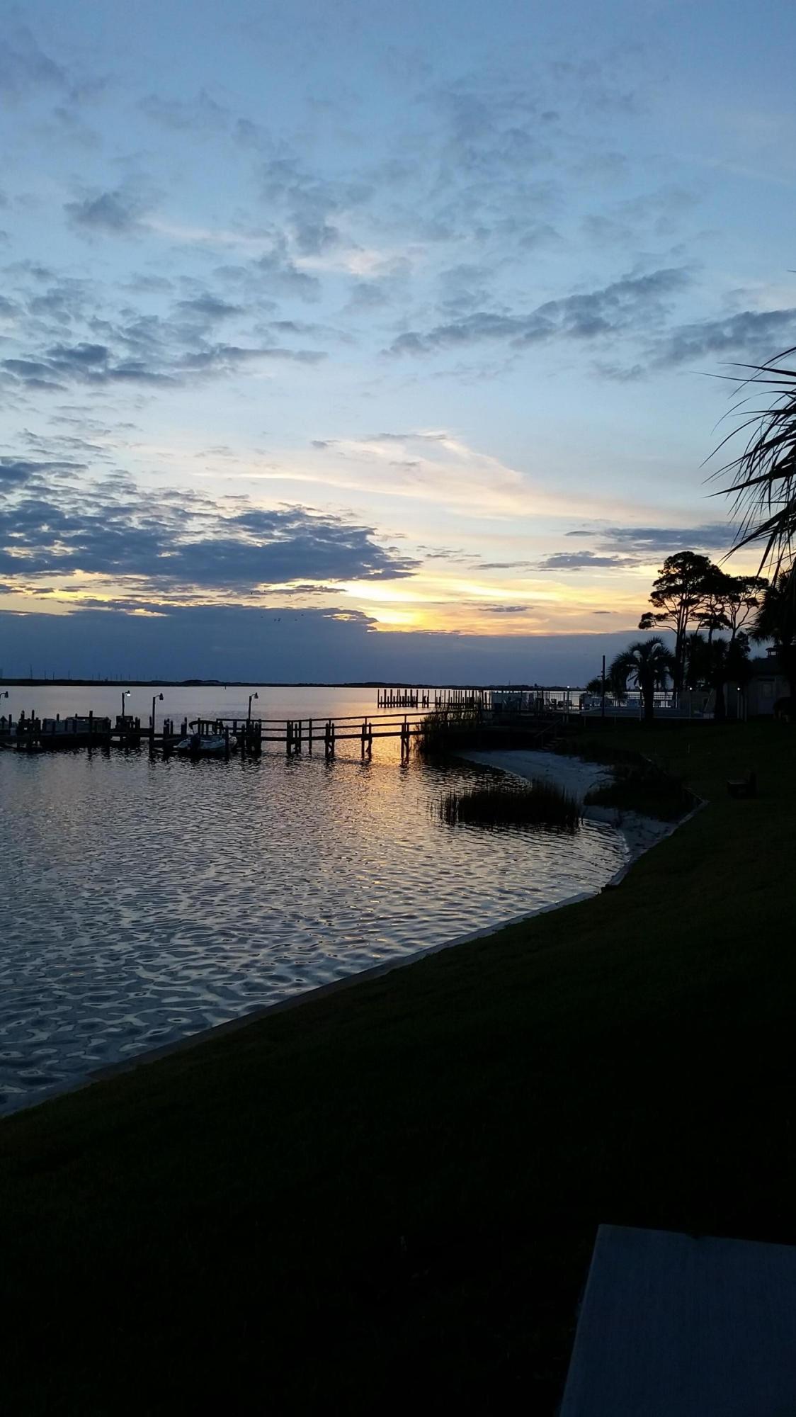 Waterfront and furnished. This ground floor 1 bedroom is ready to occupy and enjoy. We all move to Florida for the beautiful sunsets and water sports and this is the perfect place for both. The patio is steps away from Santa Rosa Sound where you can watch fish jump, crab crawl along the sand and steps from the dock. There is a sandy beach where you can launch a SUP, sun by the waterfront pool, or dock your boat and run to Crab Island on the weekend. The condo is newly painted, has tile floors, granite counter tops and a nautical theme. It is furnished and has a washer and dryer.