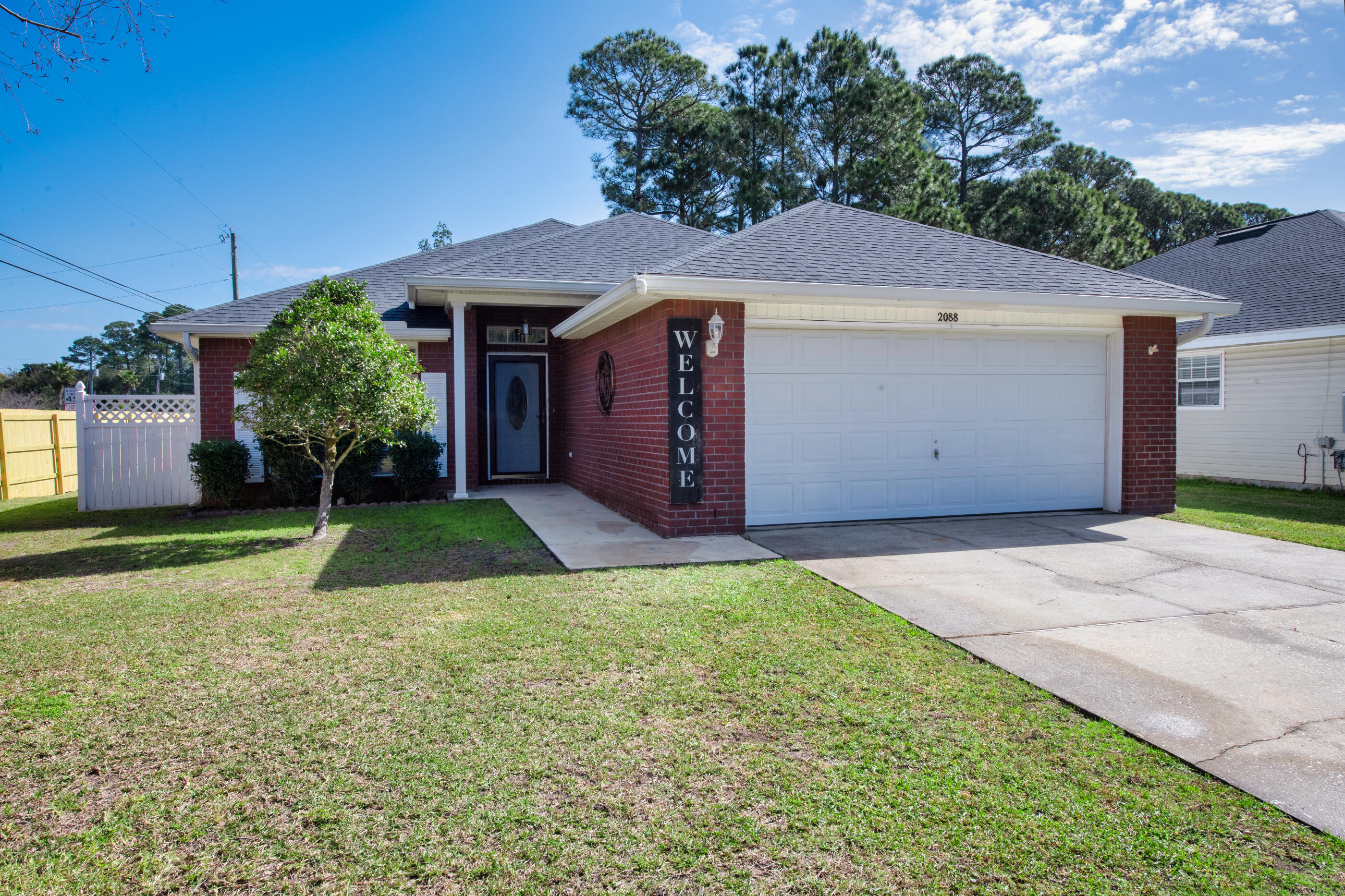 If you've been waiting for a clean, move-in ready home in Gulf Breeze that doesn't need a project list, this is it. Located in Shadow Lakes, this 3-bedroom, 2-bath home offers a smart layout, solid construction, and the kind of corner lot privacy buyers appreciate. It's the type of house that just makes sense the moment you walk in.
Built in 2004 and meticulously maintained, the home features a split floor plan that gives the primary suite separation and privacy. The living area flows easily into the kitchen and dining space, making it functional for everyday life or hosting friends. The primary suite offers a walk-in closet, double vanities, garden tub, and separate shower. Outside, the corner lot provides extra breathing room and a manageable yard. With a two-car garage and low HOA, this is an easy decision for buyers looking for value in Gulf Breeze.