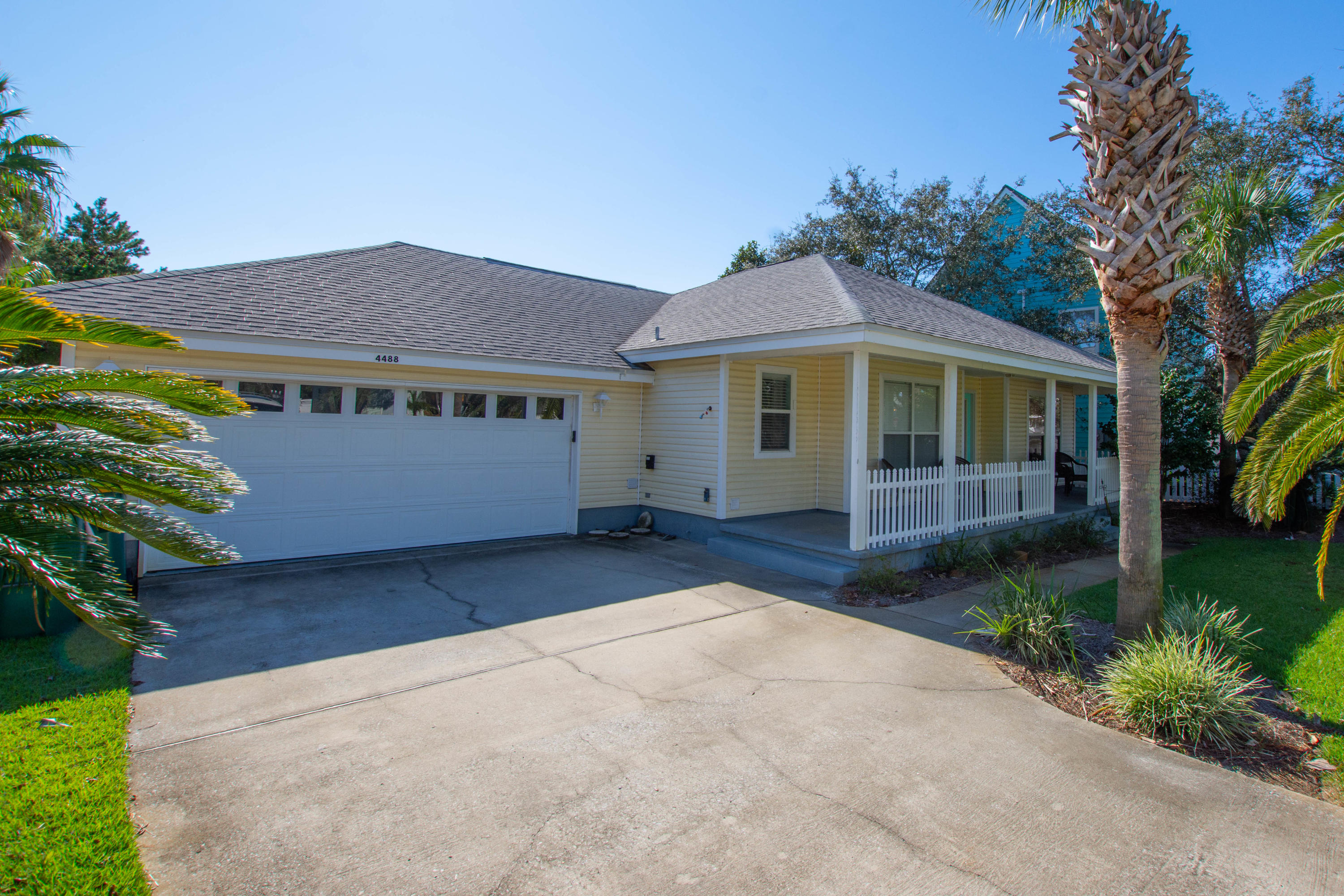 A quintessential beach house complete with a white picket fence in Crystal Beach...which conjures of images of sun splashed days biking and walking to the beach. This home features 3 bedrooms plus a 4th bedroom/office den. The spacious family room features a soaring vaulted ceiling and tile floors throughout the main living areas. Lushly and tropically landscaped exterior with a large deck for alfresco dining and entertaining. Just a hop, skip and a jump to the beach, as well as the private pool available to all Crystal Beach Cottages residents - this home is a perfect residence, 2nd home or short/long term rental income producer!