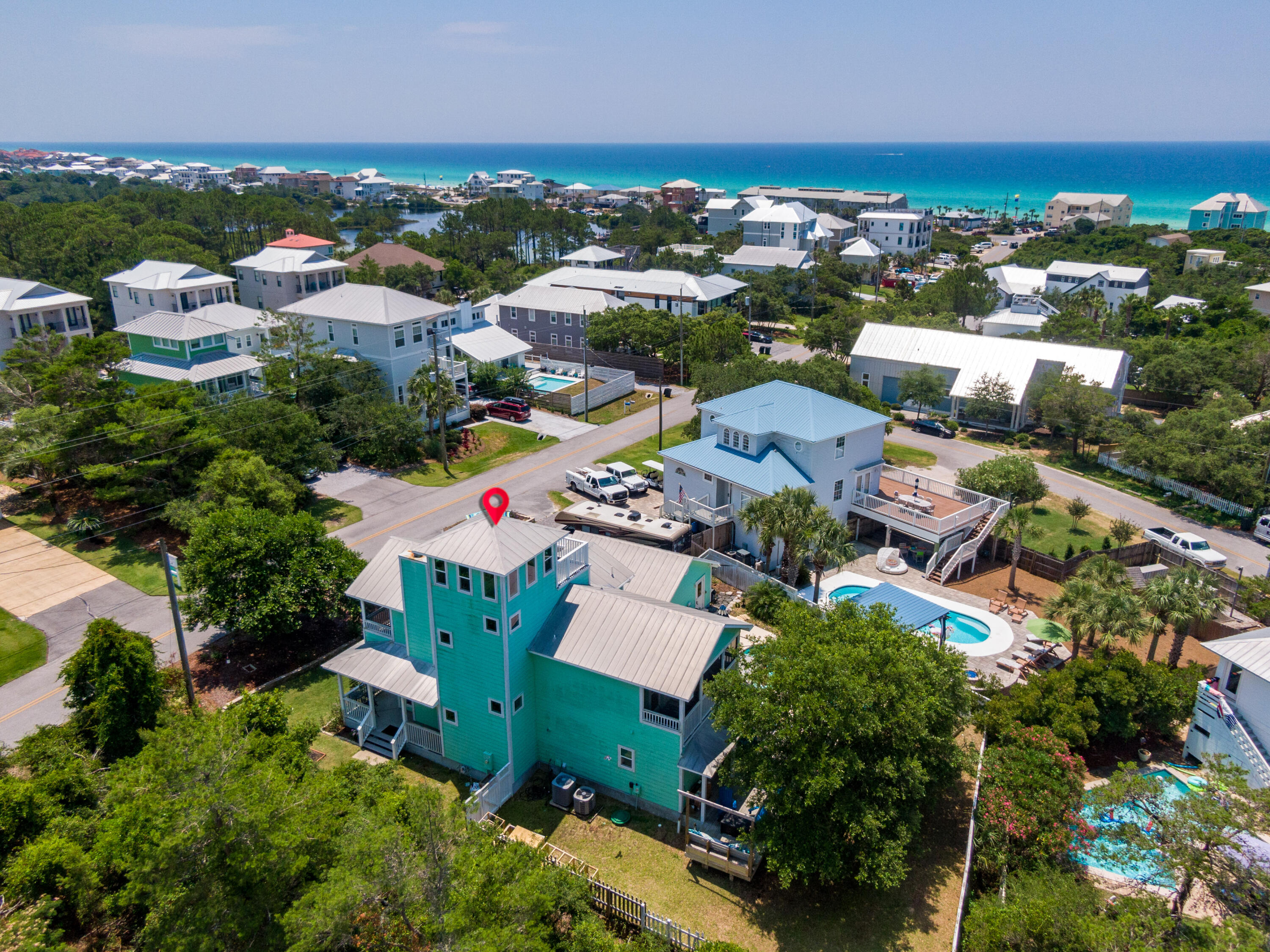 185 Hilltop Drive in Santa Rosa Beach, Florida is located just two blocks off of Scenic Highway 30-A with excellent beach access and tons of wonderful attractions nearby. This home sits on a generous lot with it's own private pool and features beautiful gulf views from the top deck! The house has 3 full bedrooms and 3 full bathrooms with a main floor living/kitchen/dining area and wraparound front porch. The 2nd floor affords the master bedroom and guest bedroom both with en-suite baths and their own private, screened in balcony. The 3rd floor 'lookout tower' has a nice area for sitting indoors or step out on to a good sized deck and feast your eyes on the gulf from this elevation nearly 60 feet above sea level. A large two car garage is detached from the home and the driveway offers tons of parking for approximately 6 vehicles. 185 Hilltop Drive has been lovingly cared for and lived in by the owners so whether you are looking for a primary, second home or fabulous rental investment this property can serve all needs. Beach Highlands is a laid back community with NO HOA on the west end of 30A with 4 different beach access points within a mile of each other. The thriving Gulf Place Community just 1.5 miles east has multiple restaurants, shopping, entertainment and more! Come experience all that the west end of 30A has to offer and FIND YOUR PARADISE!