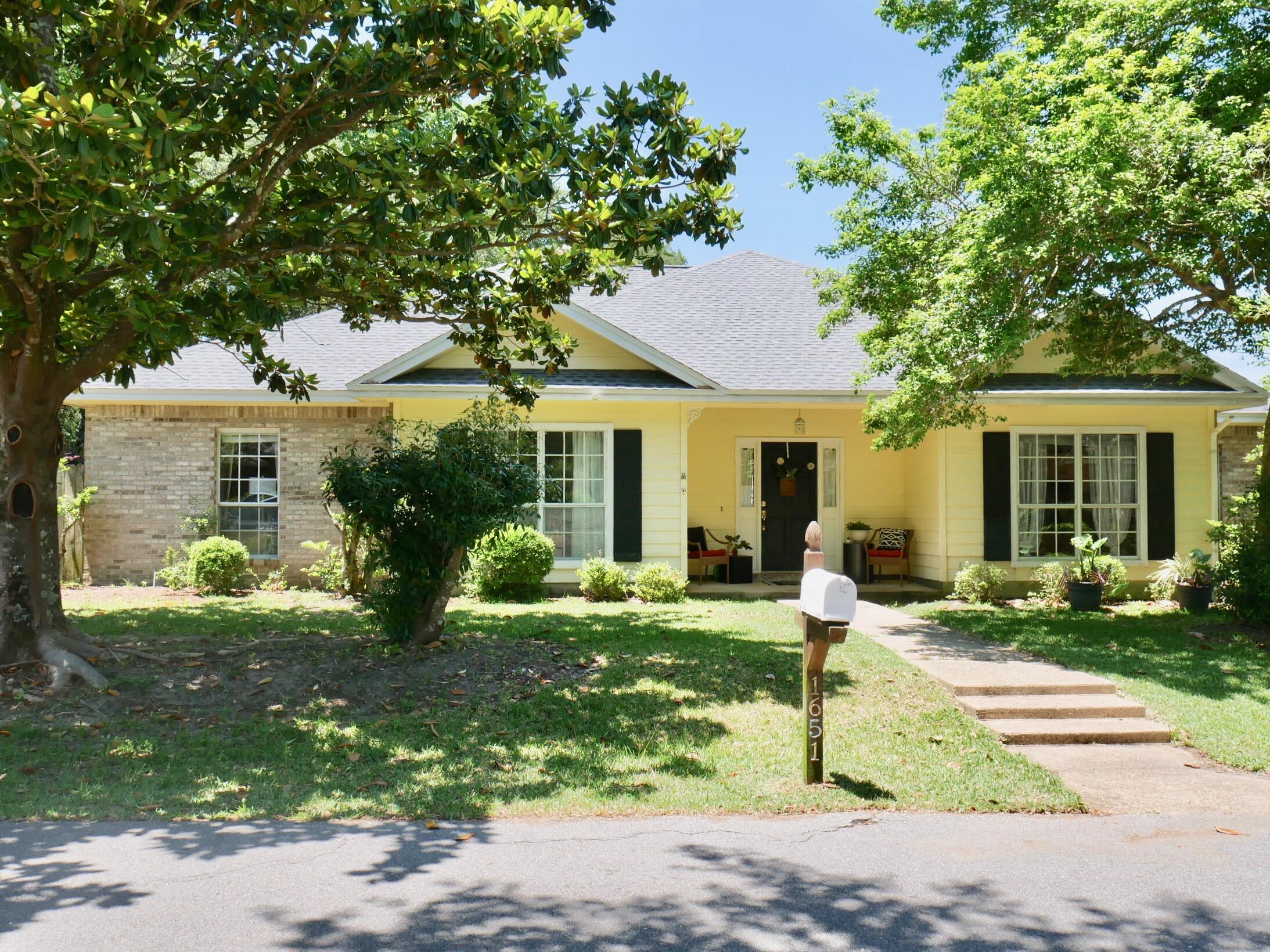 This updated and beautifully maintained Parkwood Estates home with a NEW ROOF is just what you have been waiting for!! Located on a .43 acre lot on the corner of a private cul-de-sac, there is plenty of room for the kids to play and for extra parking if you need it. When you enter the home through the bright foyer, you will find yourself in a spacious great room featuring a cathedral ceiling, an attractive corner wood-burning fireplace, and plenty of room for your large, comfortable furniture. Currently used as a playroom, the dining room could also be utilized as an office. The kitchen off of the dining room offers granite counters, refinished cabinetry, and stainless appliances. It is open to the oversized breakfast room with plenty of space to share casual meals with family and friends plus a convenient computer desk. The master suite is oversized and features a master bath with a walk in shower and soaking tub. There are two additional bedrooms as well as another full bath to complete this home. Along the back of the home is a 40' long deck accessible from the master bedroom or from the great room (the hot tub has not been used in years and conveys as is). Shaded by mature trees and shrubs, you'll love the large fenced backyard. Roof (2022), Water Heater (2019), compressor (2015)