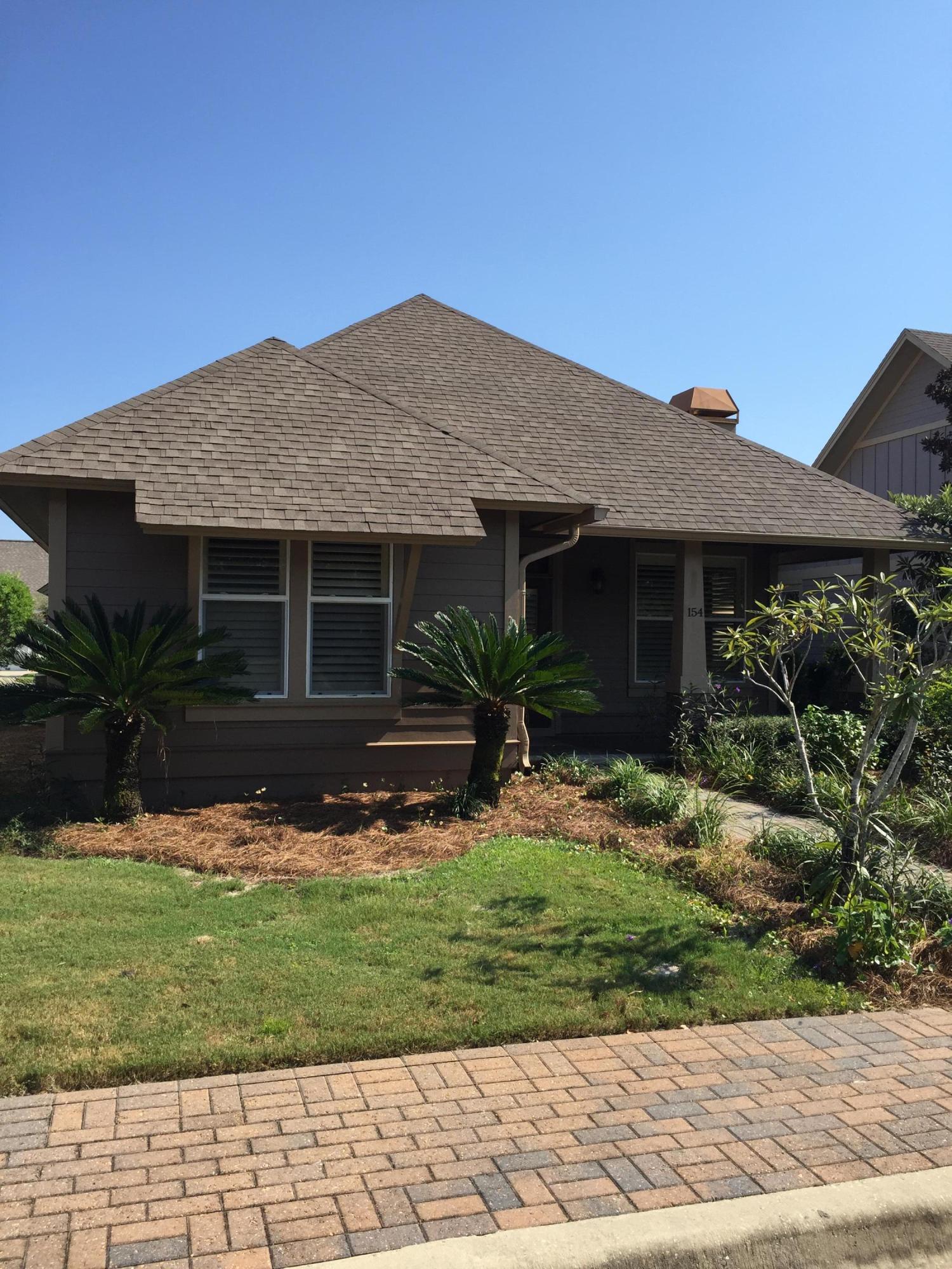 Beautiful home in Hammock Bay!!!! This 3 bedroom and 2 bathroom home has just been repainted inside and out. This custom home features an open floor plan with large living area, dining room and open kitchen with breakfast bar. The custom kitchen has granite countertops, custom cabinets and stainless steel appliances. The living room has a nice gas fireplace, lots of natural lighting and wired for large TV and surround. The master bathroom has a large walk-in closet, granite counter tops and double vanity. The home has large tile throughout and an allowance for new carpet to be installed in the bedrooms. The owner has $9000 in plantation shutters installed throughout the home. Enjoy all Hammock Bay has to offer!!!!!