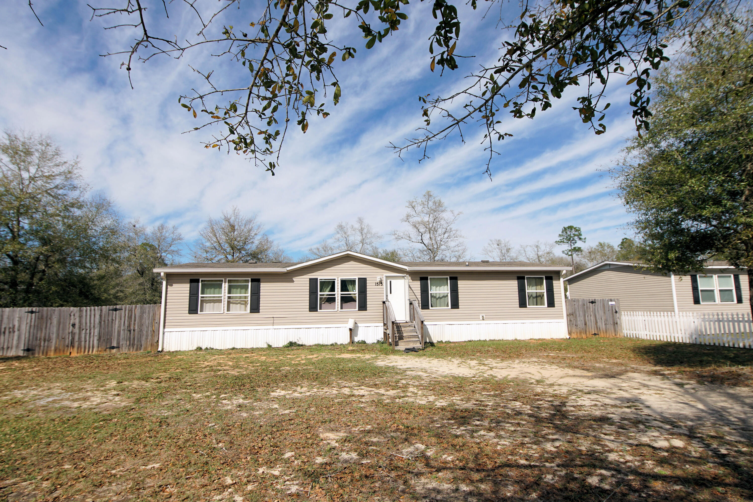 Cozy home with a super nice lot and tons of space. Privacy fenced back yard with a spacious deck and additional uncleared land behind fence. The home features an open floor plan with large dining area suitable for entertaining. Home is being sold with all furniture included. Come check this one out!