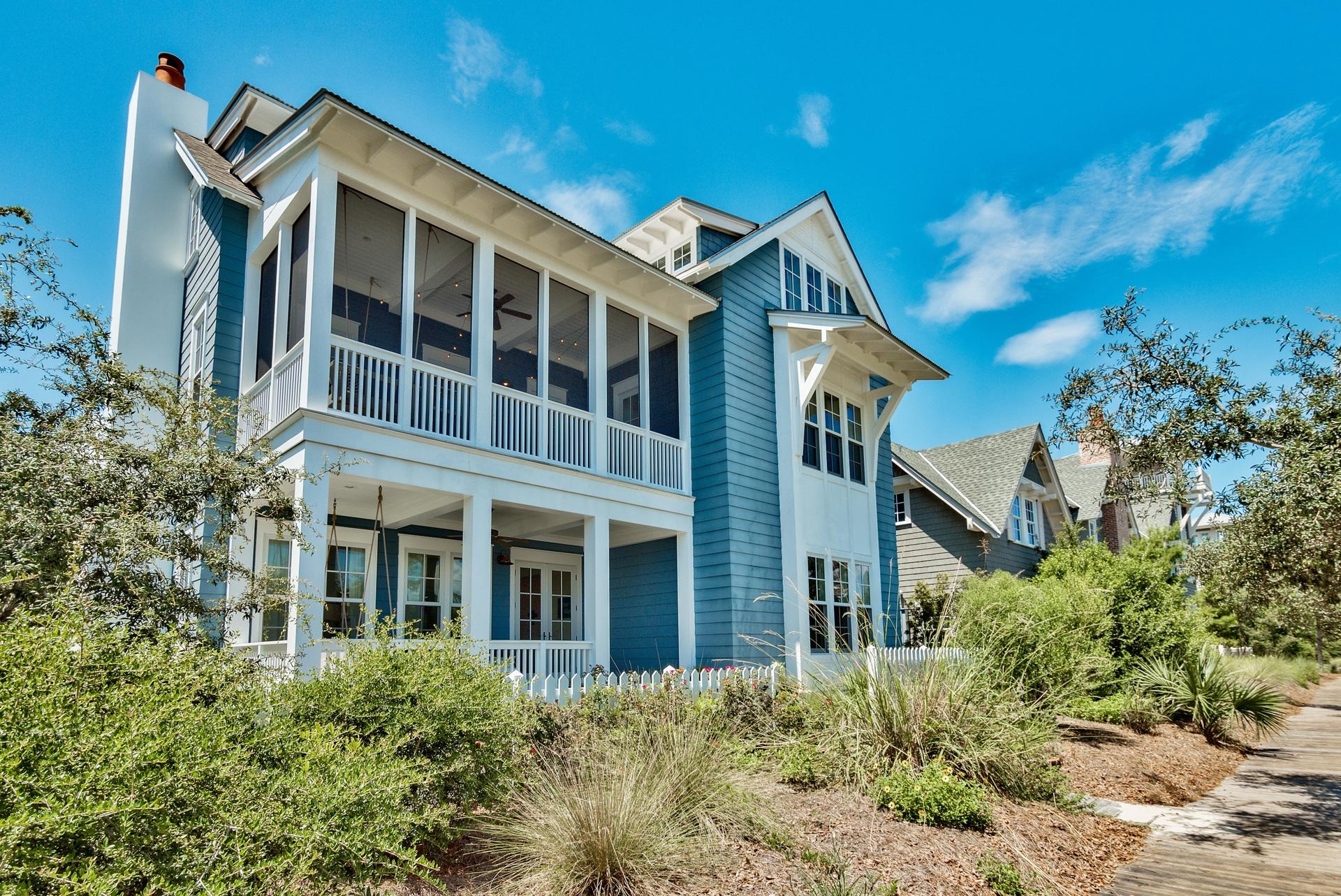 The beach community of WaterSound welcomed the Dream Team, architect Geoff Chick, builder Chris Clark along with the talent and personality of the owners of this Classic Coastal Beach home, featured in Coastal Living magazine. Perfectly placed on an East facing lot welcoming the rise of the sun from the cozy front porch swing, you enter a family room with a place for everyone. Surrounded by windows flooding the room with filtered light, the slipcovered sofas and upholstered chairs await. With the color palette of varying shades of blue & green with pops of cherry & chartreuse give way to a cheerful, ultra-casual vibe. The floors throughout the home are reclaimed heart pine rough cut and are one of the finishes that make this home special. In addition, wood planked walls painted "Vanilla Milkshake" are the background for the pops of color in the linens, art and painted furniture pieces throughout. Mother of pearl backsplash on the back wall of the kitchen shimmer over the Jenn-Air 6-burner gas range and convection oven, flanked by a refrigerator on the right and a freezer on the left. Custom cabinets, coffered ceiling, walk-in pantry and an island topped with Quartz large enough for several cooks in the kitchen make this an entertainers dream.  On the 2nd floor, a laundry room, two master suites each with a clawfoot soaking tub, extra-large shower, walk-in closet share a private screened in porch with a swinging bed and views over WaterSound. The kids have full reign over the 3rd floor with a loft entertainment space. The girls to the left with a 4 bunk-bed room, private bath and boys to the right with 8 bunks, private bath and custom built cubbies.  The screen porch off the living room opens to the courtyard with multiple possibilities, room for a pool and space to play. Two outdoor showers and the outdoor laundry keep all the sugar white sand where it belongs. This home is being offered furnished for your enjoyment.