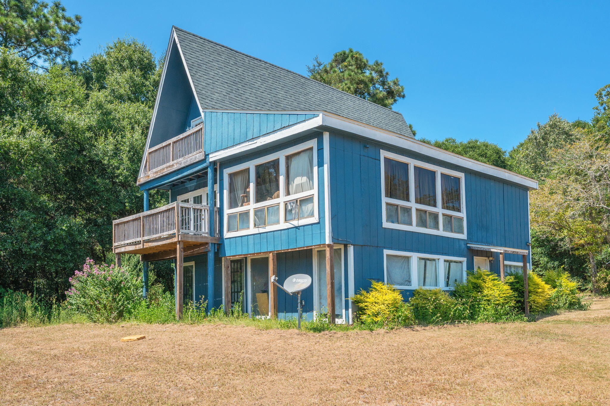 Nestled in the peaceful countryside, this 3-story cabin sits on 1.23 acres and offers the perfect opportunity for anyone looking to invest in a project with potential. Featuring 4 bedrooms and 2.5 baths, the home has seen some updates but is ideal for a buyer eager to add their own personal touch. The second and third floors house spacious bedrooms with beautiful views of the surrounding land, making it a perfect retreat for those seeking quiet living and room to grow. Whether you're looking for a weekend getaway or a full-time residence, this property is a rare chance to create something truly special.

Roof - 2022
Hot Water heater- 2016
Septic Tank pumped- 2022