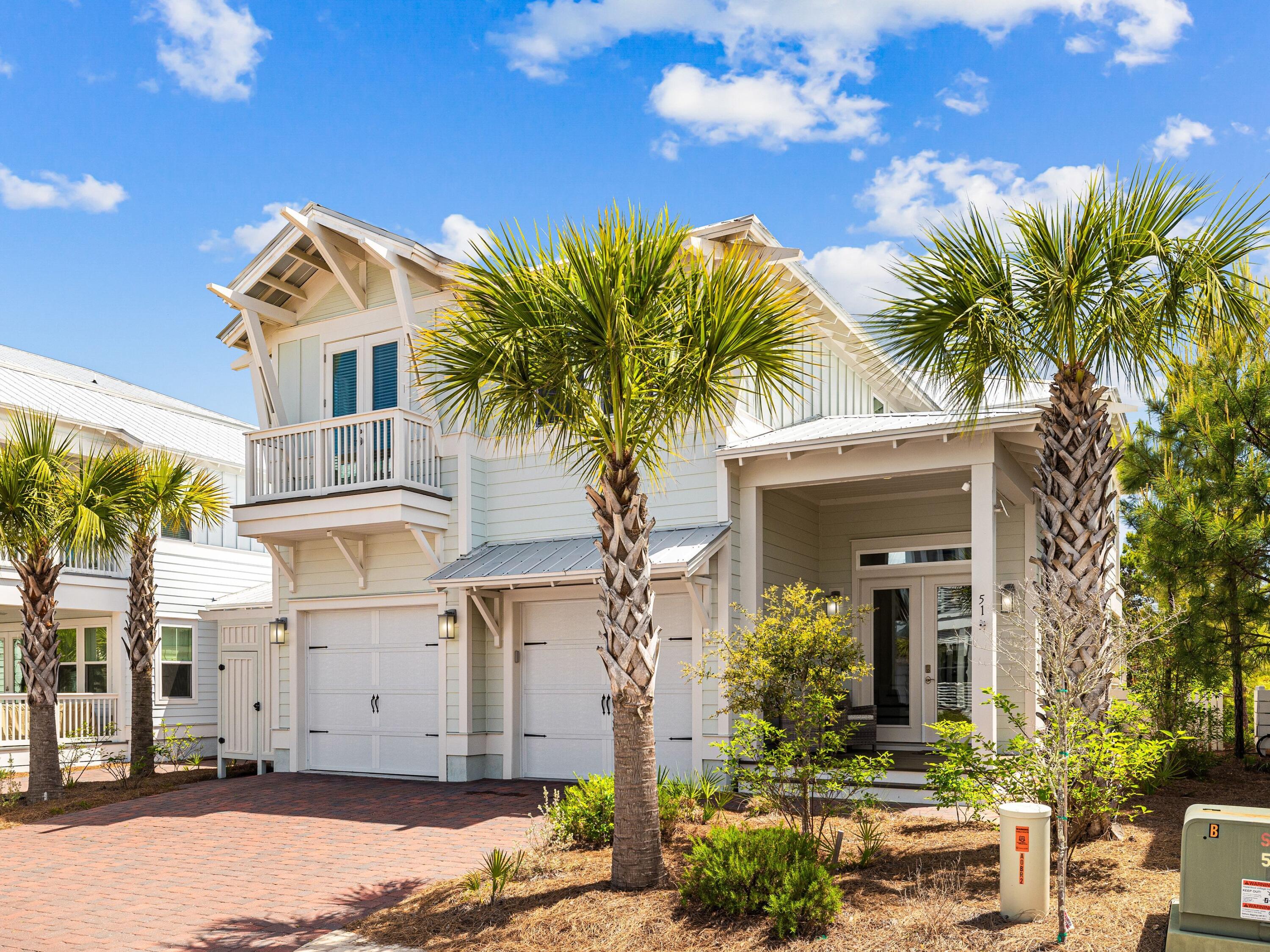 This meticulously maintained home, offered fully furnished and rental-ready, presents an unparalleled investment opportunity with the lowest price per square foot for a newly built property in the highly sought-after 30A area of Inlet Beach. Whether you're looking for a primary residence, vacation retreat, or income-generating rental property, this home excels on every level. Nestled in the serene and luxurious Prominence community between Watersound Beach and Rosemary Beach, this residence embodies modern coastal living at its finest. Situated on a quiet private street on the gulf side of 30A, it is within walking distance of two resort-style pools, walking and biking paths, boutique shopping, and stunning sunsets. Abutting a natural common area, the expanded covered porches create a tranquil setting to relax and enjoy the coastal breeze.
Entering from the covered front porch, you are welcomed into a spacious foyer that leads directly into the Maui open-concept floor plan, featuring a carefully designed interior with 10' ceilings, charming shiplap, expansive trim, and oversized windows that flood the space with natural light. The kitchen boasts stunning quartz countertops, upgraded stainless steel appliances, an island with seating for seven, and a large walk-in pantry. A seamless transition into the living and dining areas makes this a perfect retreat to unwind and entertain after a day of coastal adventures. Step out to the expanded covered porch that offers a serene setting to relax, grill, and enjoy meals with the ocean breeze at your back. Upstairs, you'll discover four spacious bedrooms with three baths (two of which are en-suite), an additional flex/bunkroom, and a convenient laundry room.
The exterior features unique architecture with highly durable Hardie-plank siding and metal roofing, complemented by brick pavers lining the driveway and walkway. An enclosed outdoor shower provides a practical way to keep the sand outdoors after a long day at the beach.
Prominence on 30A offers the perfect blend of Southern coastal charm with its white sandy beaches, fine dining, boutique shopping, and "The Big Chill," just steps away for food, entertainment, and family fun. This sought-after community caters to active lifestyles while providing a peaceful retreat.
Featuring a spacious layout, desirable amenities, and a high-demand location, this property offers the ideal opportunity to own a piece of paradise on 30A.