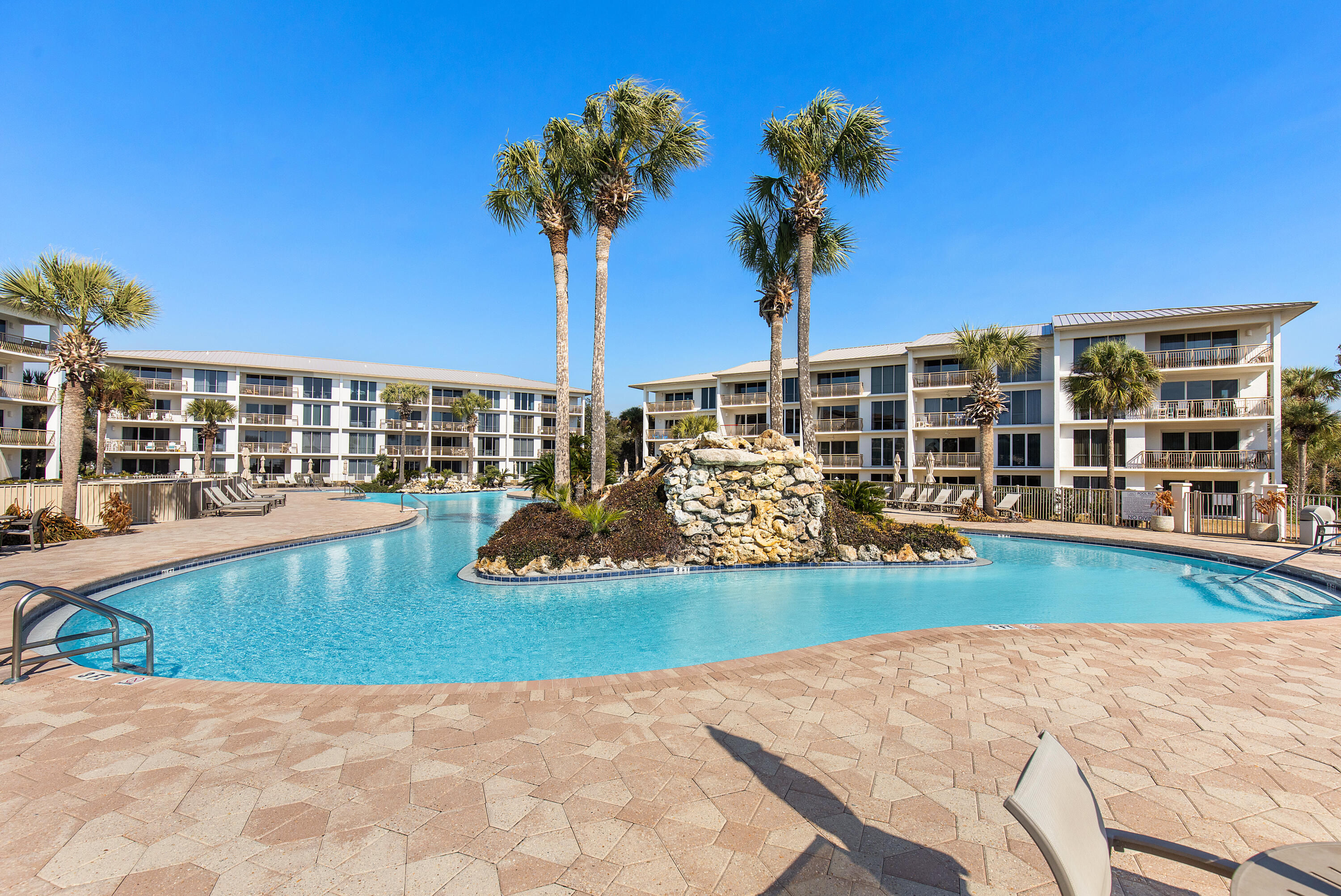Turnkey 2-bedroom, 2-bathroom condominium located in the gated Gulf-front community of High Pointe Resort in Seacrest Beach along Scenic Highway 30A, Walton County, Florida. This first-floor condo offers direct access to the resort's lagoon-style pool and is just steps from private deeded beach access.

The open-concept floor plan features a bright living area with large windows overlooking the pool, seamless indoor-outdoor flow to a covered poolside patio, and a fully equipped kitchen with stainless steel appliances, ample cabinetry, and dedicated dining space. In-unit washer and dryer included.

The primary suite offers a king-size bed, ensuite bathroom, double vanity, walk-in closet, and tub/shower combo. The guest bedroom is thoughtfully designed with two queen beds and easy access to a full guest bathroom, making the layout ideal for families or guests.

High Pointe Resort amenities include a Gulf-front lagoon-style pool, hot tub, tennis courts, pickleball, shuffleboard, children's playground, on-site seasonal dining, and 24-hour gated security. Located in the heart of Seacrest Beach, owners and guests enjoy easy access to dining, shopping, bike paths, and all that Scenic 30A has to offer.

This property is offered fully furnished and rental-ready, making it an excellent primary residence, second home, or high-performing short-term rental investment.