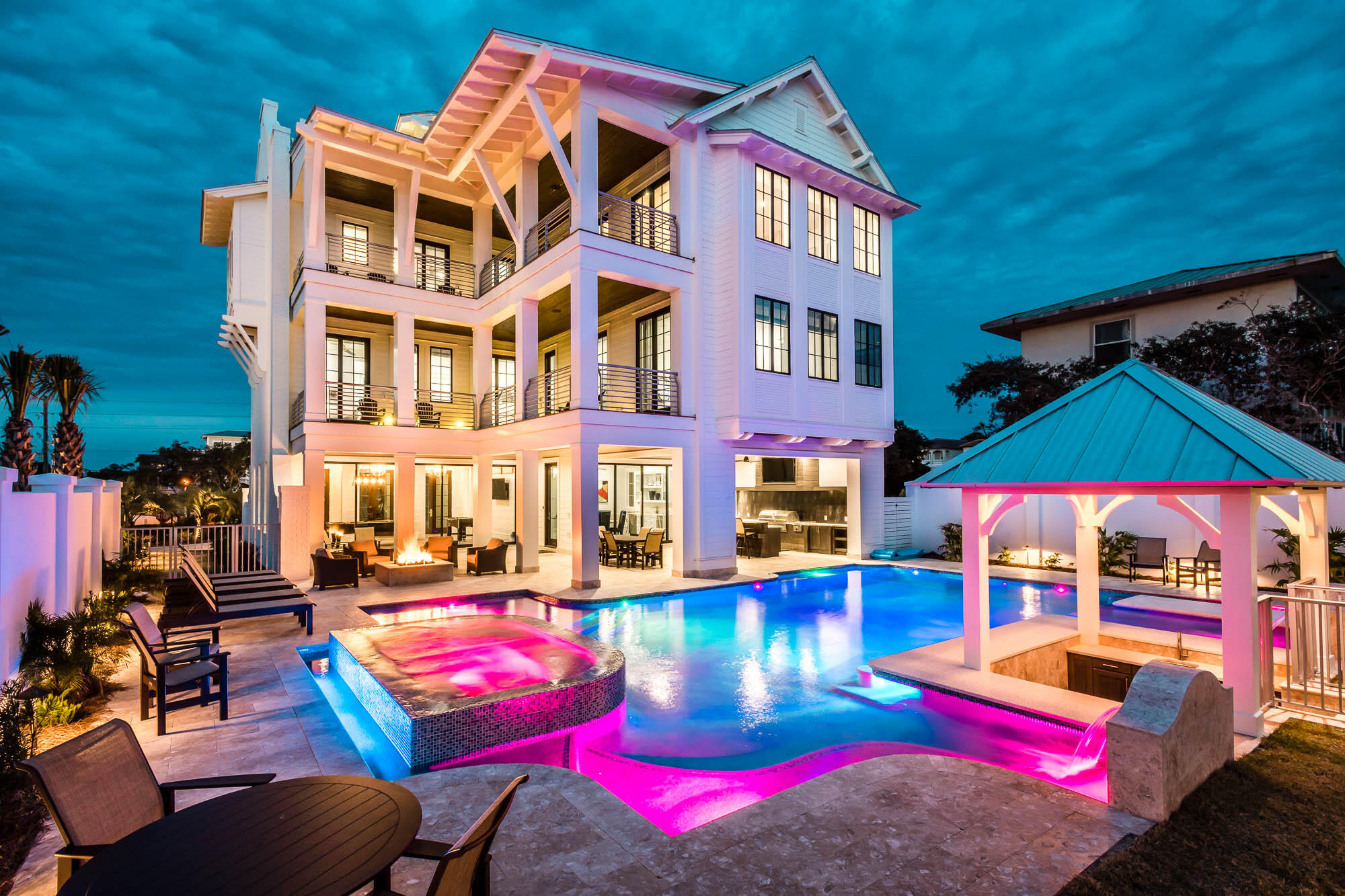 Welcome to 35 Hinton Drive, a gorgeous 4-story home located in the beautiful community of Seagrove Beach! This beautiful home is conveniently located directly on 30a and situated between Seaside and Seagrove, near restaurants, shopping, and live entertainment. And, every necessity and amenity is only a short bike ride or stroll down 30A. Filled with high-end furnishings this home is perfect for both couples and larger families, and would make an excellent primary home or even a lucrative vacation rental! Breathtakingly beautiful, this 9 bed, 10 bath home features stunning water views and the largest private pool on Scenic Highway 30A. 
With its 2 car garage, the home offers a luxurious sprawling 7,056 SF. Dubbed "La Piscina," which translates to "the pool" in Spanish, this Seagrove coastal retreat features one of the largest private pools on 30a. This home also features over 2,600 feet of covered balconies and outdoor living space. Perfect to grab a cocktail with friends and family, this home is truly outstanding when it comes to entertaining. "La Piscina" is also located just one tier off the Gulf, located just steps away from the white sandy beaches and emerald green waters of the Gulf. This home features secured, deeded Beach access as well. 

Head inside the sprawling first floor of this coastal palace, and you'll find an area that is all about relaxing and entertaining. The first floor boasts more than 7,000 square feet that features a large game room, a living room, and a common area with a wet bar overlooking the pool. Breakaway, French doors help open the space, to seamlessly enjoy both indoor and outdoor experiences. 

Head upstairs to the second floor which features a bunk room with individual flatscreen TV's and a shared bath with shower. There are five additional king bedrooms with ensuite bathrooms, including one of the home's two master bedrooms. Each of the bedrooms feature their own covered balconies, perfect for enjoying gentle sea breezes. 

Head upstairs to the third floor, where you'll find the home's primary living area with a large open-plan kitchen, dining and living rooms. The kitchen is equipped with high-end appliances including a Viking range, walk-in pantry, ice-maker, wine cooler and two dishwashers. The dining room can accommodate up to 14- perfect for dinner parties. Host your dinner parties at sunset, where your guests will be able to enjoy breathtaking views from the balconies that extend from the living room and overlook the Gulf. The home's other master bedroom is also located on this floor with Gulf views and a soaking tub. 

Head upstairs to the fourth floor, which is a dedicated widow's walk. Perfect place for a morning cup of coffee or afternoon cocktail- take in the sunrise or sunset with breathtaking views of the Gulf. No detail was spared in this home- which features a private elevator, 2-car garage with additional dedicated parking, and laundry facilities on two floors. This home also features a breathtaking beautiful outdoor living space, which features a large pool with sitting spa, swim-up bar, and in-pool table. An outdoor kitchen is conveniently placed by the pool, with a covered dining area and built-in firepit. 

Don't hesitate to schedule your showing at one of the most breathtaking homes available on the market today. 

Buyer to verify all information and dimensions. Information is deemed reliable but not guaranteed.