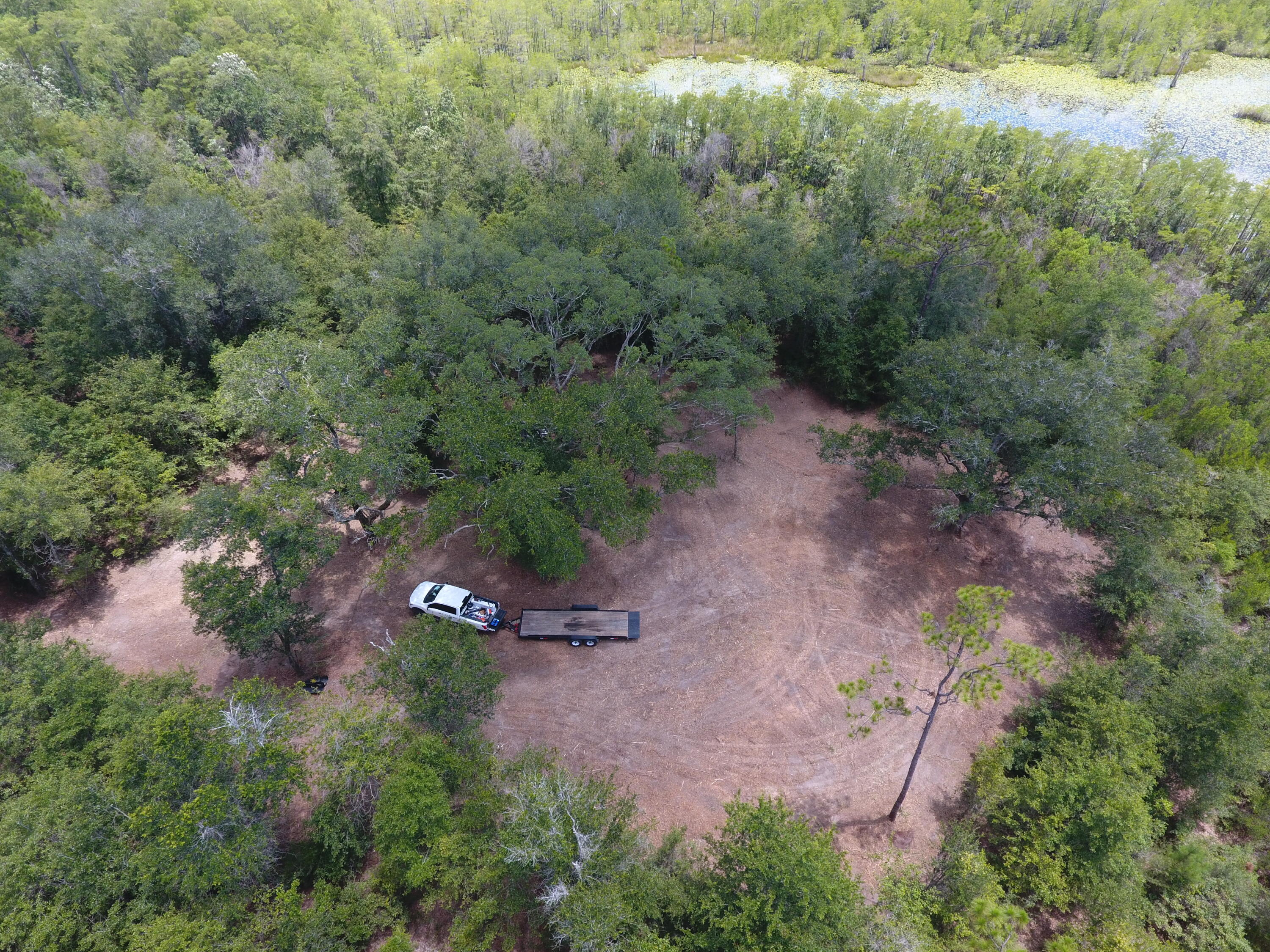 Beautiful approximately 40 acre parcel located on a private setting less than 5 minutes south of Bonifay with paved road frontage.  Mostly wooded parcel with large duck pond has a new driveway installed with a new gate and entrance and trails into the property. Nice cleared area at the end of the trail close to the natural duck pond. Endless hunting, fishing and recreational possibilities. Bring your horses and livestock and build your dream home. Located about an hour from the beach and close to multiple parks and lakes. Fast access to Interstate 10. New survey available.