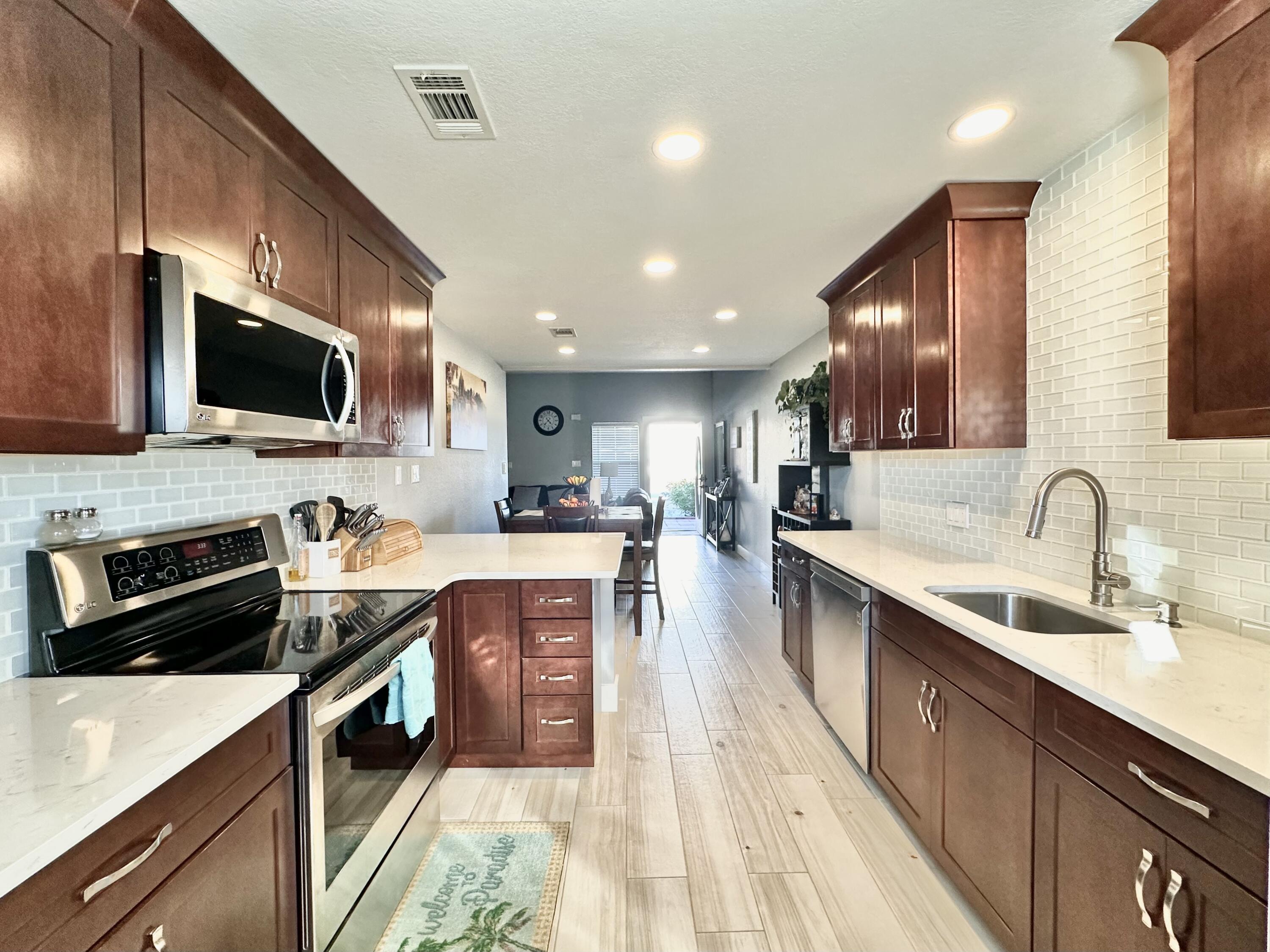 Wonderful opportunity to own this renovated townhouse  in the heart of Destin as your primary or investment property! Quail Lake townhomes come in high demand due to their superb location near to all the best shopping, restaurants, and entertainment. This 3 BED/2 BATH home features wood looking tile  downstairs, remodeled kitchen, including countertops and stainless steel appliances, large lower level master bedroom/bath, , full garage with washer and dryer hookup, two spacious bedrooms and renovated bath upstairs!
Buyer to verify all dimensions and written information