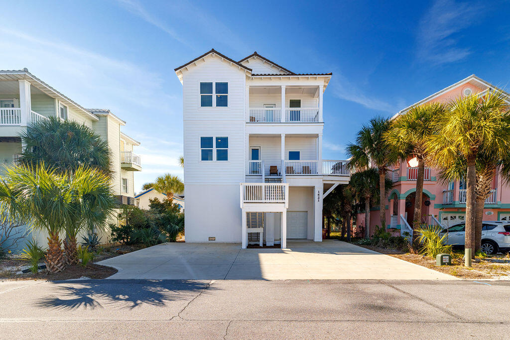Built in 2024 by acclaimed Shiloh Construction, this stunning 3-story coastal residence in the Village at Navarre offers refined design, quality craftsmanship, and an exceptional lifestyle just moments from the beach. Featuring a tile roof, Hardiplank and stucco exterior, wide vinyl plank flooring, quartz countertops throughout, and crisp white subway tile, the home blends timeless coastal style with modern luxury. The open-concept living, dining, and kitchen areas are designed for effortless entertaining, with stainless electric appliances and generous prep space. The versatile floor plan includes 2 bedrooms, 2 full baths, and a half bath on the first level, 3 additional bedrooms and 3 full baths on the second level, plus an office/bonus room with a full bath that can serve as a study, guest suite, or bunk room. Outside shower!  Dual HVAC systems and two electric water heaters enhance comfort throughout. Enjoy a private grilling terrace with room for a custom pool, plus access to the community pool and private boat dock on the Sound. Set on a 50' x 98' homesite with a one-car garage and ample guest parking, this property is ideal as a primary residence, second home, or investment opportunity with 2025 bookings already in place.