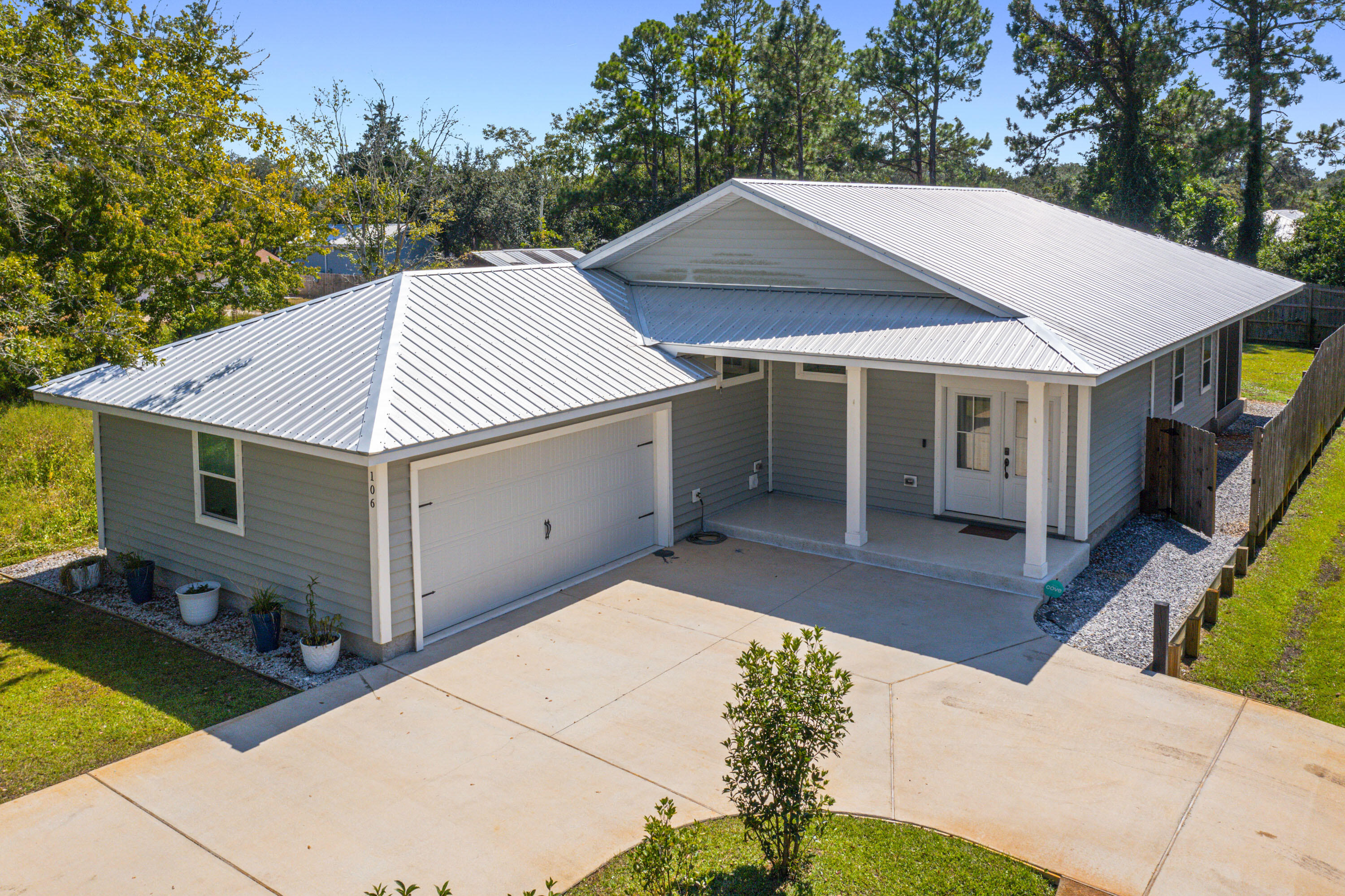 Welcome to this beautifully crafted 2022 home in the quiet Villa Tasso neighborhood of Niceville. This 3 bedroom, 2 bathroom residence offers 1,838 sqft of thoughtfully designed living space with a side-entry 2-car garage and durable metal roof.

Inside, enjoy modern finishes including quartz countertops with butcher block accents, premium vinyl flooring throughout, and tile in all bathrooms. The spacious Primary Suite features 10' ceilings, a large walk-in closet, and a stunning walk-in shower with bench seating. Step out onto the screened-in back patio—perfect for relaxing evenings—accessible from both the living area and Primary Bedroom. Built with energy efficiency in mind, the home includes a radiant barrier, blown-in insulation, and a 240V EV charger in the garage. Conveniently located just minutes from the Mid-Bay Bridge, providing quick access to shopping, dining, and the world-famous white-sand beaches of Destin.