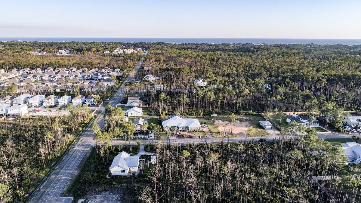 Build your perfect beach home on this large half-acre residential lot in Thompson Plantation, a 17-home community south of Highway 98 on the west end of Scenic Highway 30A. There is no build-out time, no formal HOA and no through traffic. You're only 1 1/2 miles from the sugar-sand beaches of the Emerald Coast and near numerous shopping, dining and recreation opportunities.  Being South of Hwy 98 allows you the opportunity to golf cart to the beach from your new home, or better yet bike ride as the paved boardwalk leads you the entire way.
