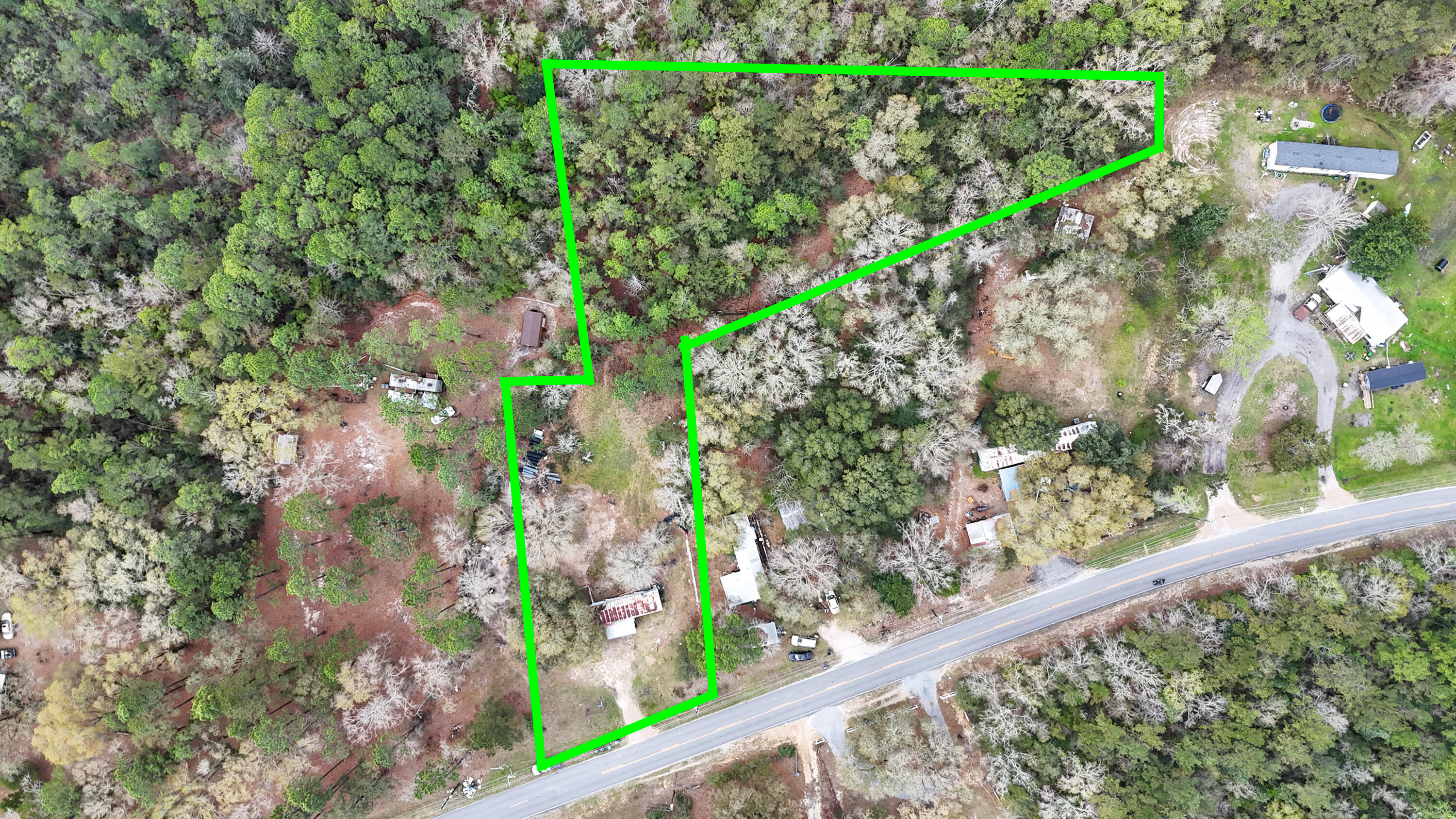 Tucked away on 1.66 acres across two separate parcels, this unique property at 522 Black Creek Boulevard in Freeport offers space, flexibility, and incredible potential. The property features a 3-bedroom, 2-bath, 1972 fixer upper mobile home, making it a great option for a weekend getaway, rental opportunity, or a place to stay while you plan your future build.

Currently zoned Estate Residential, the land provides plenty of room to create your ideal homestead, private retreat, or build the dream home you've always wanted. With over two acres, there's space for gardens, workshops, recreational toys, or simply enjoying the peaceful surroundings. Located just a short drive from the beautiful beaches of South Walton, you'll enjoy the perfect balance of privacy and convenience--close to world-class beaches, dining, and shopping while still having room to spread out.

Whether you're looking for a coastal escape, investment opportunity, or a homesite near the Gulf, this property offers endless possibilities in the growing Freeport area.