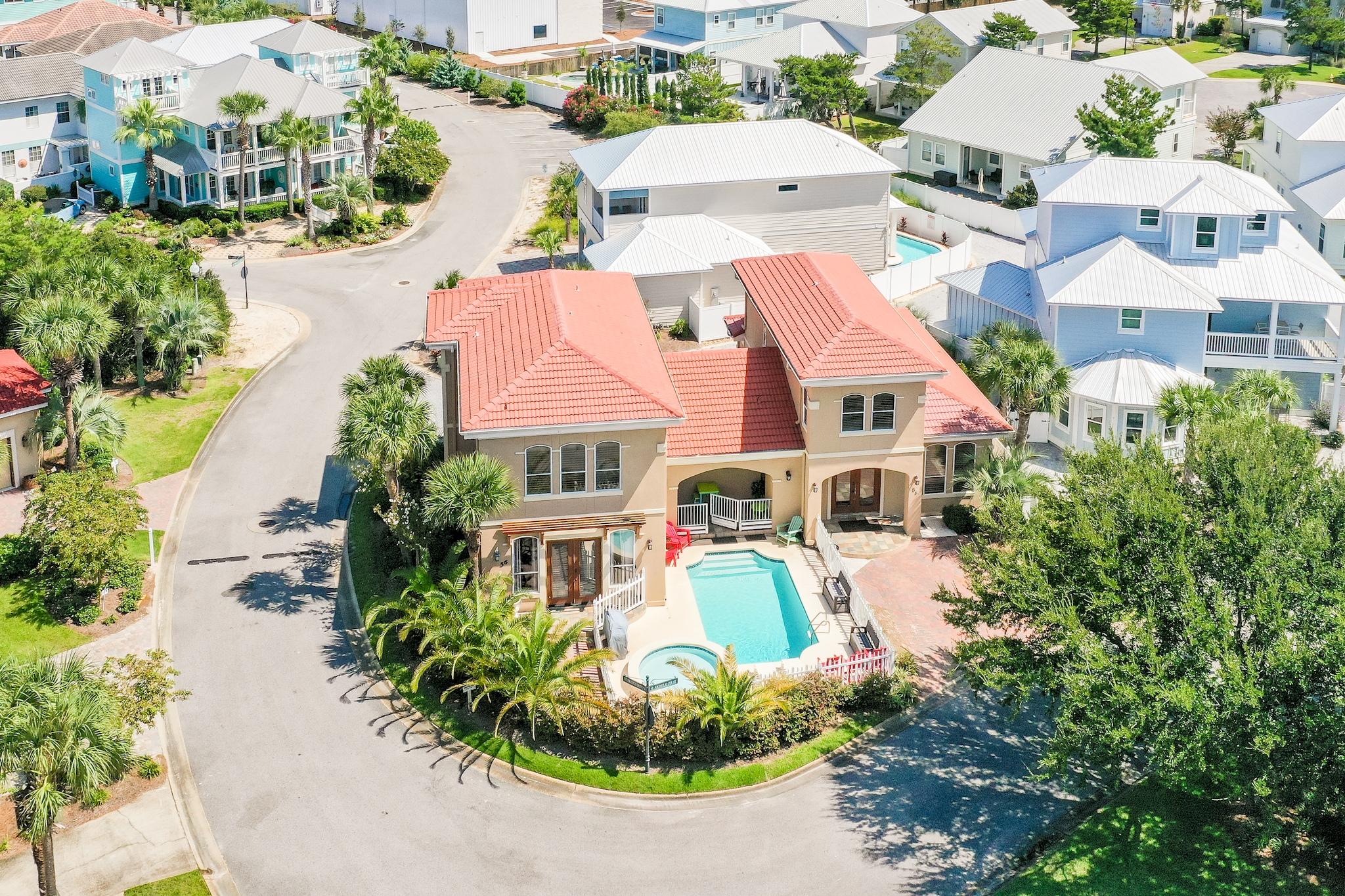 NEW white paint! Welcome to paradise. This phenomenal 6-bedroom luxury home is located in the upscale community of Emerald Waters Village, just across the street from the beautiful beaches along the emerald green waters of the Gulf of Mexico. This home is considered a ''double home'' with a unique floor plan that offers 2 separate wings - the East & Wing wings - both consisting of its own separate entrances, living area, dining area, kitchen, 3 bedrooms, 2 full baths, a half bath & laundry closet. Well appointed with over $100k in updates! This home is a RENTAL MACHINE with rental history ranging from $85K - $100k! Located just 3 blocks from the beach, in minutes you'll have your toes in the sugar white sand. The home itself is a private oasis with a large private pool area featuring a spacious pool deck, hot tub, and covered patio. The covered patio and pool area are perfect for outdoor dining and entertaining. This home has many "Smart" automated/remote control features that can be changed from your phone wherever you are - including entry door controls, air units, pool pump, pool/spa heater, West wing water heater, and even the WiFi! 

Both wings feature 10 ft ceilings, crown molding, custom wooden plantation shutters, and tile floors. The West wing however, features beautiful bamboo flooring on the upstairs level. The West wing living area also features a gas fireplace and direct access to the covered patio leading out into the pool area. Both living areas are spacious and are accented with beautiful columns and feature a 65" 4K TV. Both dining areas are open and spacious featuring large dining tables with seating for 8 in the East wing and 10-12 in the West wing, plenty of space for large gatherings with family & friends. Both kitchens are nicely updated with granite countertops in the East wing and quartzite countertops in the West wing, custom backsplash, ample cabinets for storage, and stainless steel appliances. Both kitchens feature a large breakfast bar with seating for 4, great for casual dining and overflow seating if needed. Both wings feature a downstairs half bath, convenient and perfect for guests. 

The East wing offers a master suite downstairs with direct access to a private deck & paver stone patio, walk-in closet, and en suite bathroom. Upstairs there are two additional bedrooms, one with a king bed and the other features a twin over full bunk bed with a trundle, which brings the sleeping capacity of the East wing to 10. Both additional bedrooms are located upstairs giving the downstairs master bedroom more privacy. Both full baths in the East wing have been updated with new vanities featuring lovely vessel sinks and tile backsplash. 

The West wing features all three bedrooms upstairs with bamboo flooring throughout, except in the bathrooms. The master suite is very spacious and offers a king bed, large walk-in closet, charming daybed, and en suite bathroom. The luxurious master bath features a double vanity with new countertop, large soaking sub, and a tiled walk-in shower. The two additional bedrooms are located on the opposite side of the floor giving the master bedroom extra privacy. One of the additional bedrooms features a king bed while the other features two sets of bunk beds - a twin over twin bunk bed with a trundle and a twin over full bunk bed - which brings the sleeping capacity of the West wing to 13. In total this home can sleep 23, just another reason it's a RENTAL MACHINE! Already $23,000 in bookings for 2021 that will transfer over to the buyer!!

Both wings feature a laundry closet with a stackable full-size front loader washer & dryer. Parking is not an issue at this home with enough parking spaces for 5 cars plus a golf cart. Two cars can park in the front driveway, two cars in the garage, and one more car plus a golf cart in the back driveway. Each wing can also be accessed from the back of the home. 

This home is located at the front of the community, just through the security and to the left, with quick access to the private beach access. The community offers two community pools as well, with one being just 100 ft away from the home. Emerald Waters Village is an upscale community centrally located close to all the amenities of Destin, Miramar Beach, and 30A offering premium shopping, dining, and entertainment options. Go north on Holiday Road to enjoy the serenity of the Choctawhatchee Bay, ideal for kayaking and paddle boarding. Enjoy shopping at the Silver Sands Premium Outlets or head over to the Destin Commons. This home is close to fantastic restaurants such a Pompano Joe's and Whale's Tail, both local favorites offering Gulf front dining. Don't miss this incredible opportunity to own such a beautiful & unique home located in such a desirable location!