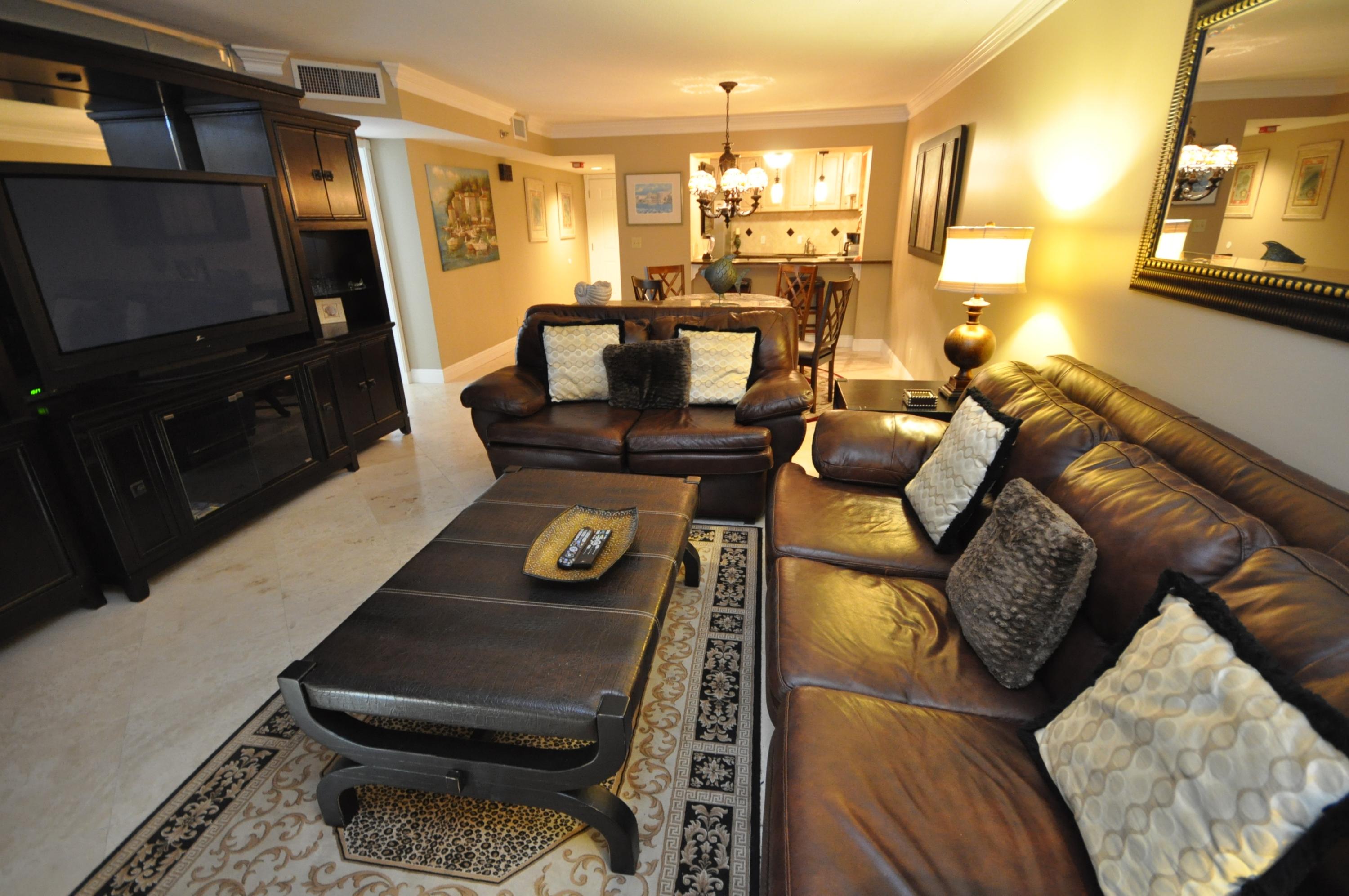 Completely remodeled beachfront condo! Located on the 8th floor with southeastern and south views of the gorgeous emerald green waters and white sandy beaches of the emerald coast. Beautifully furnished in a warm, rich decor' with a large entertainment center, huge flat screen tv, and leather sofas. Enjoy low maintenance 18' travertine flooring throughout the entire condo. In addition, the kitchen is updated with granite counters, a stainless steel fridge, wine cooler, smooth top stove, and a beautiful tiled backsplash. The bathroom has been remodeled with dark, elegant marbled tile from the floor to the walls and inside the shower. The upgrades carry into the master bedroom with tiled floors, rich dcor, flat screen tv, and breathtaking views of the beach. This condo is a must see! You will be hard pressed to find a nicer 1 bedroom gulf front condo for the price.  As an added bonus and to introduce the new owners to the Sandestin lifestyle, the listing brokerage and seller(s) are offering an incentive package to the buyer(s) of this property: Golf for four on one of our three championship courses, a pass for four to Sandestin's exclusive Beach Club, and an introductory membership to the Burnt Pine Golf Club. Sandestin Golf and Beach Resort is a major destination for all seasons and all ages, and has been named the #1 resort on Florida's Emerald Coast. This magical 2,400 acre resort, comprised of over 70 unique neighborhoods of condominiums, villas, town homes, and estates. The resort features more than seven miles of beaches and pristine bay front, four championship golf courses, a world-class tennis center with 15 courts, 19 swimming pools, a 113-slip marina, a fully equipped and professionally staffed fitness center and spa, meeting spaces and The Village of Baytowne Wharf, a charming pedestrian village with events, shopping, dining, family entertainment and nightlife. For true golf cart community living, Grand Boulevard is just outside the resort gates and provides access to additional shopping, dining and entertainment â€“ all without traveling on Hwy. 98.  Come to Play, Stay for Life!