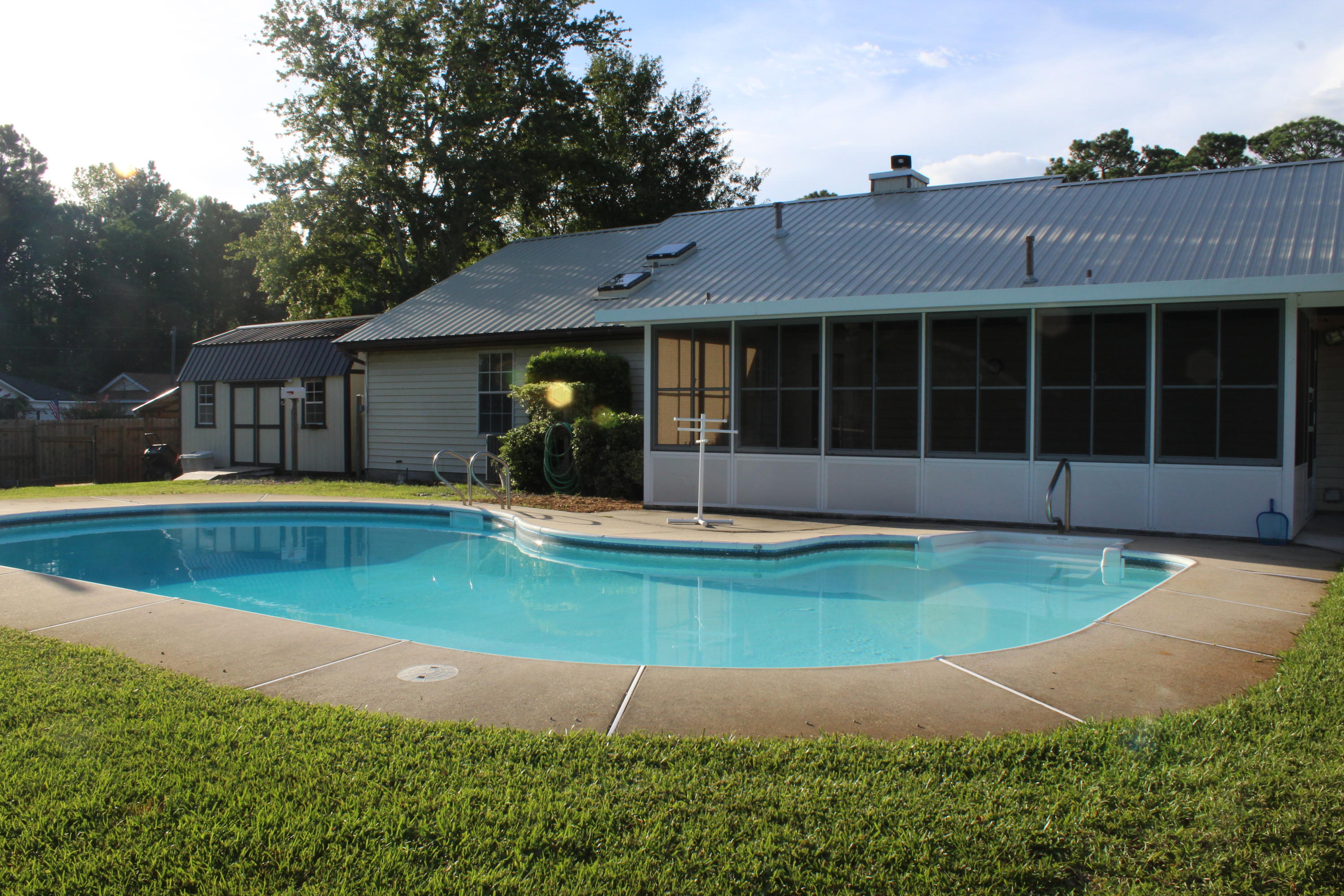 Welcome Home!   This well-maintained 3 bed/ 2 bath home in Mary Esther is located in the Quail Run subdivision. This home is approx. 3.4 miles west of Hurlburt Field Air Force Base. Convenient to Fort Walton Beach and Navarre's beautiful beaches! It is a beautiful large corner lot with mature landscaping in both the front and back yards complete with an in-ground salt water pool and a sprinkler system to keep landscaping growing nicely. In the huge backyard you will find a handy man's workshop and if gardening is your thing it is equip with your very own greenhouse! There is a nice enclosed air-conditioned porch perfect for your enjoyment no matter what the season! The fireplace in the living room is cozy and its gas, no need for wood! Two car garage with a side area  for your boat or RV. New metal roof as of February 2021, New Hot water heater in 2021.HVAC is less than 5 years old. Wait until you see the attic space, numerous possibilities and storage! Open House will be Saturday July 17th 
 12-4. This home is a must see!