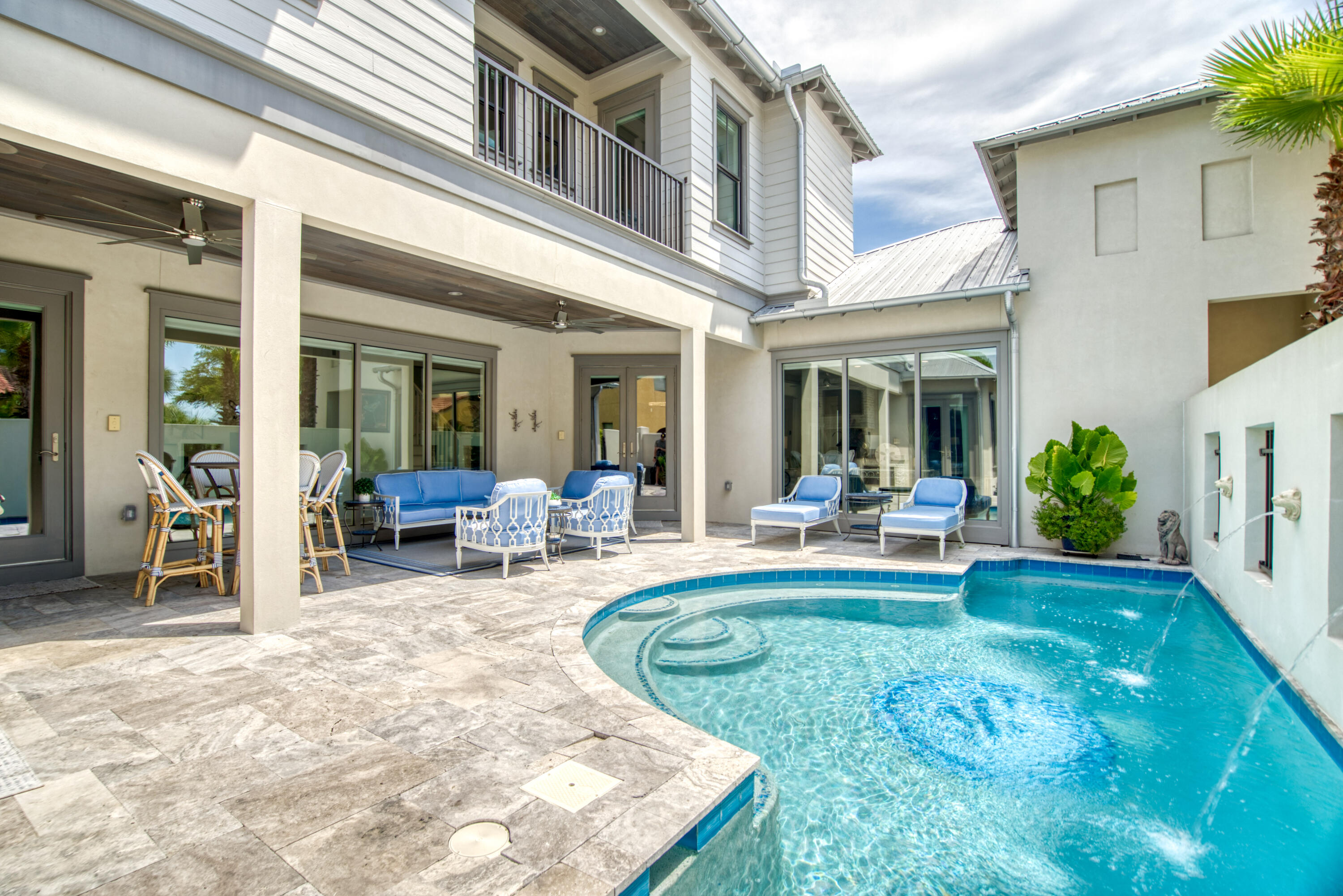 Welcome to 252 N Saint Francis! The home is located in the highly desirable,   private gated community of Emerald Waters Village. This home is every entertainers dream, boasting a spacious first floor open floor plan. Upon entering the home your eyes will instantly be drawn to the floor-to-ceiling windows  which overlook the outdoor summer kitchen and oversize private pool. The kitchen features an oversized kitchen island, the perfect place to gather around is the perfect place to gather around, quartz counter tops, burnt wood cabinetry, and top-of-the-line Thermadore appliances.