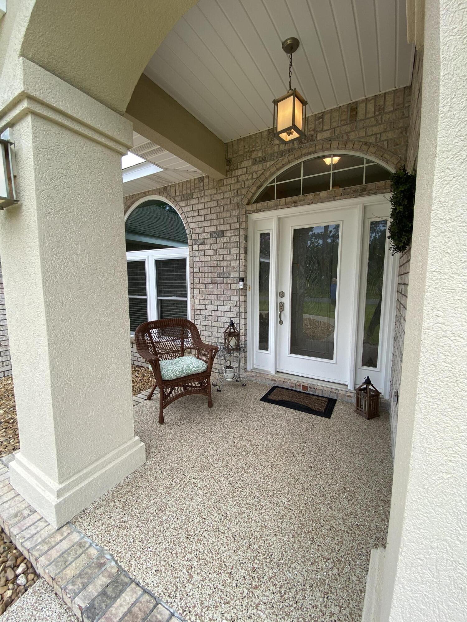BACK ON MARKET, no fault of sellers. Nestled among the big live oaks with a 'green' view of the 2nd Fairway. This home offers many extras such as built in cabinetry in the dining room and kitchen, impact windows, coated concrete driveway, walkways, back porch and patio, 3 car garage, high ceilings with knockdown texture, a large peaceful covered back patio, lush grasses front and back, new roof November 2020, and updated master bath in 2020! See list of additional updates in documents. Fireplace is plumbed for LP.  There is also a LP line on the back patio for a outdoor kitchen possibility! And room for a pool! Office can double as 4th bedroom, has a closet. Refrig in kitchen DOES NOT convey. termite bond transferable.  Buyer to verify all important information deemed necessary. See today!