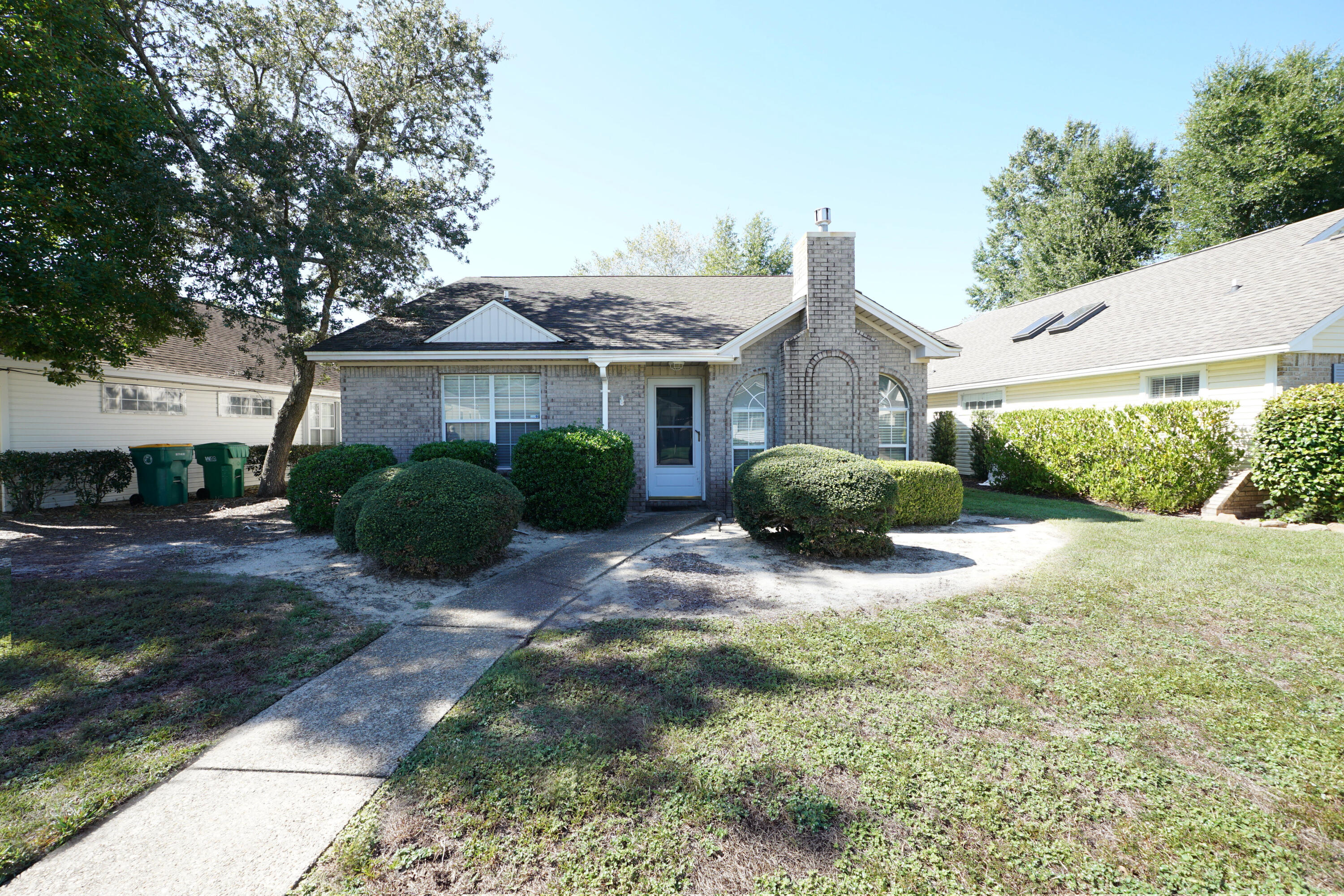 This adorable split floor plan home offers comfort and convenience in the heart of Bluewater Bay. Close to shopping, schools, beaches and Bases.
The kitchen features stainless steel appliances and opens to the dining and living areas, creating a bright, open feel that's perfect for everyday living or entertaining. The spacious living room includes vaulted ceilings and a cozy gas fireplace.
The primary suite is located at the back of the home for added privacy and features an updated ensuite bath with a walk-in shower and a generous walk-in closet. Two additional bedrooms are situated at the front of the home and share a full hallway bath.
Laminate flooring and neutral paint colors flow throughout, giving the home a clean, modern look.
Two car enclosed parking with Small fenced yard HOA maintains front yard. HOA community.

Pets may be allowed with Owner approval and a NON refundable pet fee.