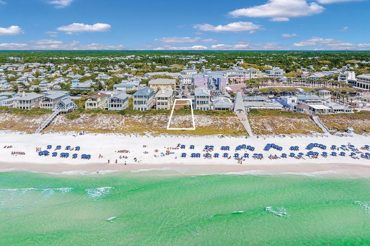Craft your bespoke seaside sanctuary on the last available gulf-front lot in Seaside, Florida. This unparalleled plot invites you to envision a stunning three-story main cottage accompanied by a charming two-story guest cottage atop the garage, promising an expansive living space of more than 5,200 square feet. Envision three sprawling covered porches, each offering serene views of the gulf, set within a design that permits robust all-concrete construction — a testament to both luxury and durability. Nestled just steps away from the Town Center, this lot sits at the epicenter of Seaside's vibrant life. A mere stroll across to Seaside Central Square unveils a world of shopping, dining and entertainment options, placing you in the heart of it all. Whether you're contemplating a primary residence, a secondary getaway, or a lucrative rental investment, this spot is unmatched in its offering. The Seaside community enhances this rare find with access to a fitness center, tennis and pickleball courts, and multiple pools, ensuring a lifestyle filled with leisure and activity.