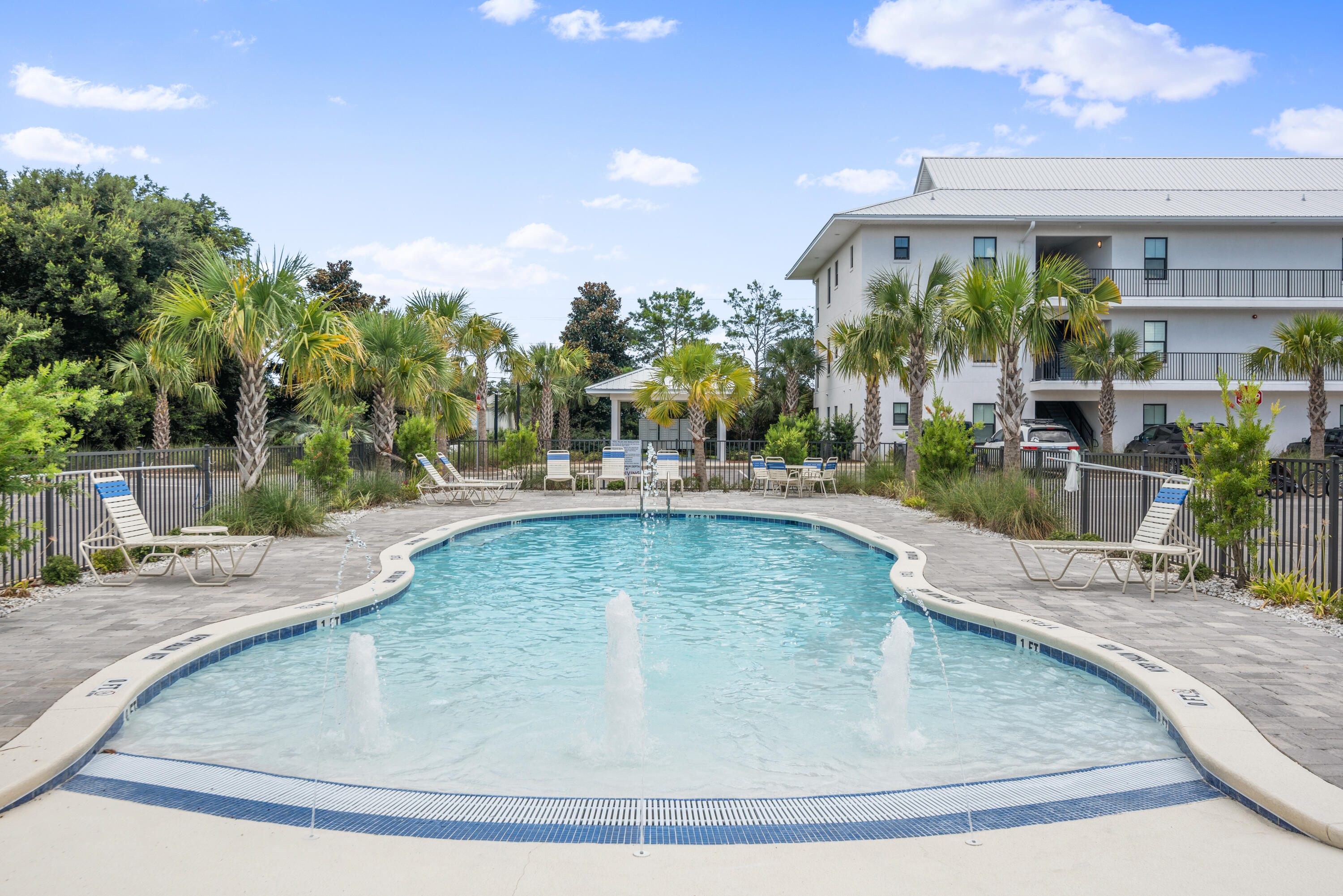 A Blue Mountain Beach gem along Scenic Highway 30A: This 2 bedroom, 2 bathroom unit boasts clean lines, 9ft ceilings, granite countertops, and seamless luxury vinyl plank flooring.  The sun-drenched unit boasts plantation shutters, easy release solar shades and garden views. Don't miss this chance to own a tastefully-furnished income-producing property. Hidden Lake condos is a 45-unit complex that offers residents modern amenities and an exceptional location. Enjoy the convenience of a ground floor unit, privacy of a gated community, and three beach access points to choose from. Hidden Lake is short walk from Gulf Place town center for shopping and dining, and a four minute drive from the recently renovated Santa Rosa Beach Golf Club.