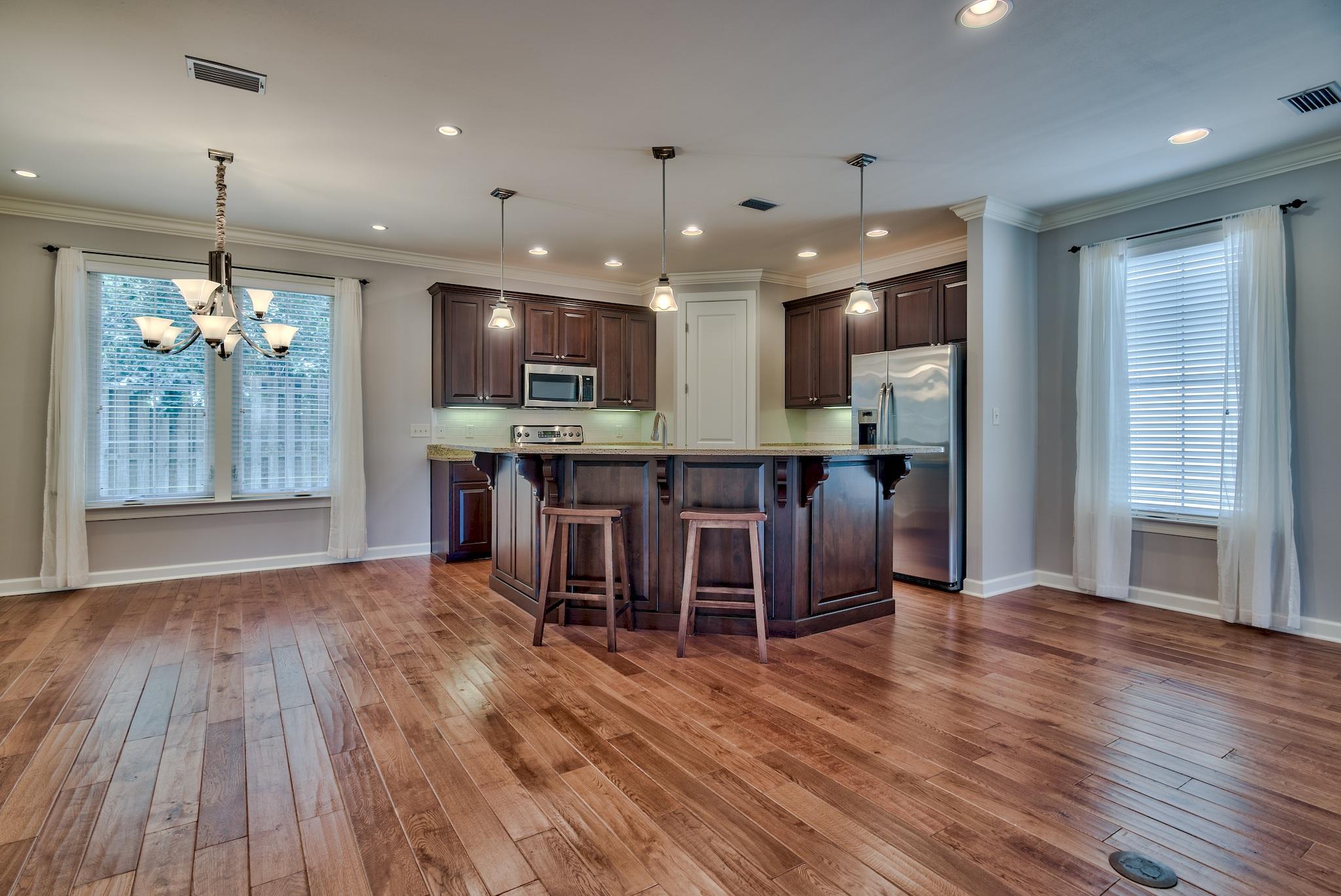 Custom built home by Huff Builders in Church Street Village. Originally an ''E plan'' that was expanded to be a 3 bedroom, 2.5 baths, 2175 square foot home with a huge office or flex room. The large open living area has 9 ft ceilings and 8 ft doors, crown molding, engineered wood flooring and surround sound speakers. The kitchen has an 11 foot granite island with breakfast bar, stainless steel appliances, and a pantry! Separate dining area with french doors out to the screened in back porch that has a brick floor and surround sound speakers too! The home sits next to the dog park and is on a perimeter lot so you have a lot of privacy! The back yard is fenced in and has a concrete patio. Lush landscaping and lawn maintenance is included in your HOA fees. The master bedroom has a large walk closet with french doors and built ins inside. You will be impressed with the master bath with a garden tub, separate shower, water closet, and a large double vanity with make up area. The 2 car garage has built in storage and there is plenty of parking in the driveway for guests! The laundry room has a washer and dryer and a great laundry shoot that brings laundry down from the second level of the home. The office / flex room also has surround sound speakers. Upgrades include wood corbels on the kitchen island, brick backsplash, refrigerator with ice and water in the door, large tiel flooring, casement windows that crank open, Maytag washer and dryer, low maintenance hardi plank siding, curtain rods on the back porch with a ceiling fan, ceiling fans in all rooms, blinds and sheer window treatments, 2 AC units, fresh paint downstairs, stairwell and office area, and a new dishwasher! Located near Sandestin, Grand Blvd, Sacred Heart Hospital and the beach is approximately 5 mins away!