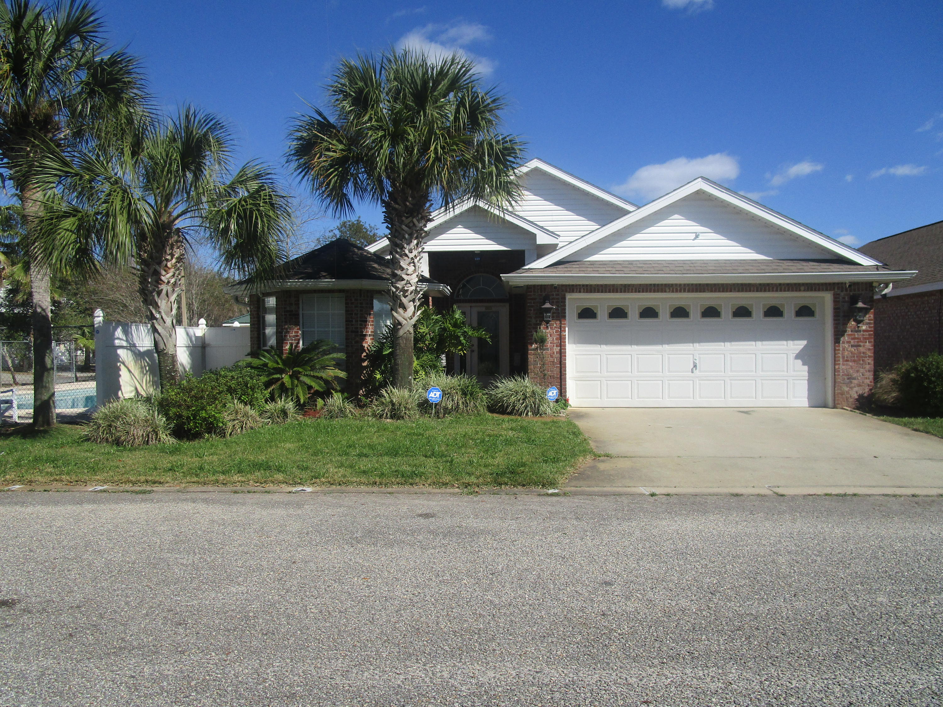 All brick home, in the deeded waterfront community of Hidden Bay, with BOAT SLIP AND 10k LB boat lift included. Fully furnished. Conveniently located across the road from the Hidden Creek golf course. Just minutes to the sugar white sands of Navarre Beach and the Gulf of Mexico. Open floor plan with 14' vaulted ceilings, custom cabinets with granite counters and work island in kitchen. 18'' designer porcelain tile in living areas and upgraded carpet in bedrooms. Built in wood bookcases. Upgraded ceiling fans, laundry room with deep tub, whirlpool tub and separate shower in master bath, brushed stainless faucets, huge master walk-in closet with extra shelving, and much more, super efficient floor plan.