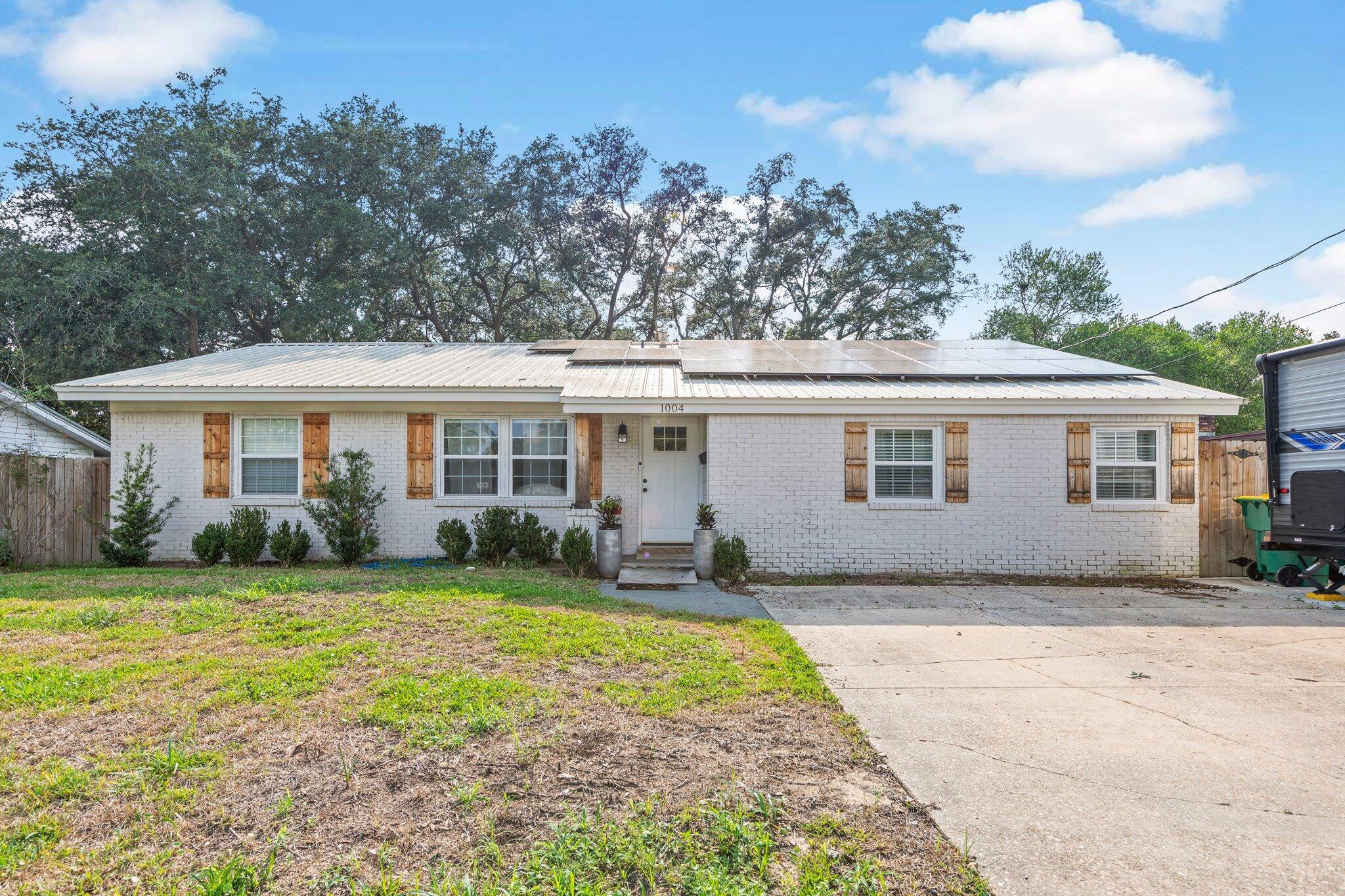 Updates galore in this beautiful 3 bedroom, 3 bath home that is move-in ready! Lots of cabinets and stainless appliances adorn the kitchen/dining area with plenty of space for a large dining table. French doors lead to an open patio and fully fenced backyard. The master bedroom has a custom walk- in closet and adjoining master bath with double vanities, soaking tub and separate shower. Popular LVP flooring throughout the main living areas and carpet in the bedrooms. Electrical, light fixtures, plumbing, windows and roof have also been replaced the last few years. This is a wonderful location convenient to all the amenities Niceville has to offer. Call for your showing today!!