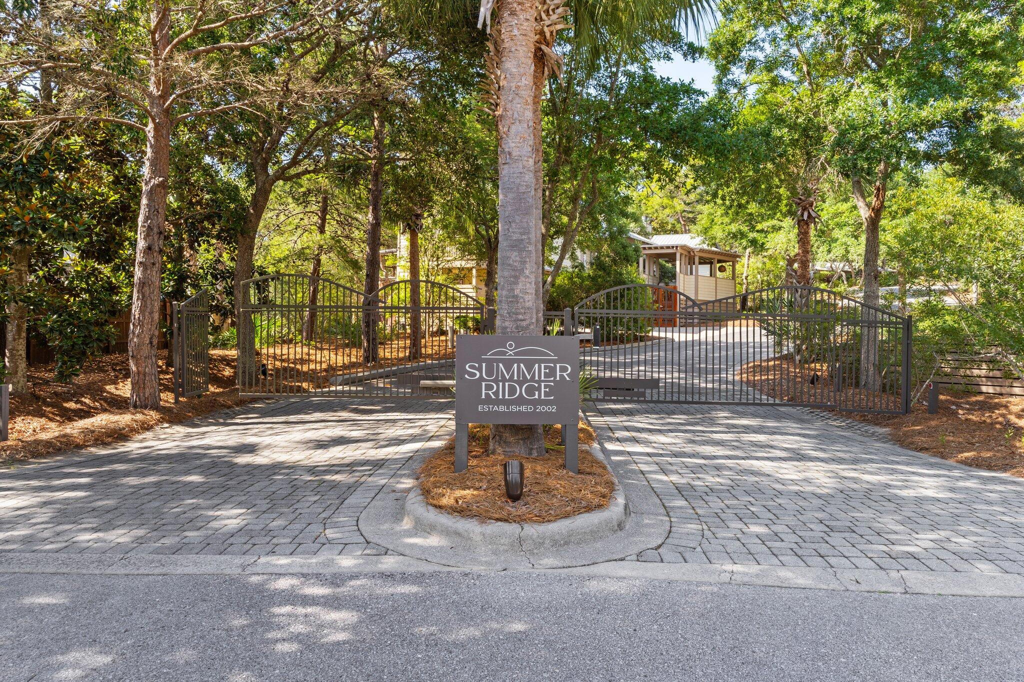 Discover serenity and sophistication at this Summer Ridge Gem.
If you've been dreaming of a home that is truly a one-of-a-kind, this beautifully renovated residence in the gated, rent-restricted
community of Summer Ridge is your answer.
This is a courtyard style home that boasts lots of outdoor space. The private courtyard is a sanctuary surrounded by nature. Hear the soothing sounds of a wall fountain blended with the warm glow of gas lighting and fire table, creating an outdoor retreat you can enjoy year-round. The home has a first floor primary retreat with several luxurious features. Upstairs you'll find two spacious bedrooms, one with an adjoining porch. The home has hardwood floors, designer lighting, landscape lighting, a summer kitchen, and an extended rear covered lanai. Enter through the double mahogany and glass doors into a spectacular great room. The soaring 13-foot cathedral ceiling, crafted from cypress wood, creates an airy and inviting atmosphere. Anchoring the space is a stunning gas fireplace, designed in the Tabby shell style, and complemented by a custom pecky cypress mantle. 
Adjoining the great room is a kitchen that seamlessly blends functionality with elegance. Custom-made inset cabinetry, high-quality appliances, and Montauk Quartz countertops provide a timelessness space for cooking and gathering.
The main floor is home to the luxurious primary bedroom retreat, with views and access to both the front courtyard and a new spa tub located just outside the primary bath door. The suite also boasts his-and-her walk-in closets with custom shelving and an en-suite bathroom. Indulge in the cast iron soaking tub, double custom vanity, frameless glass shower, and honed marble floors,a spa-like experience in the comfort of your own home.

Thoughtful Details at Every Turn:
The first floor also features a lovely powder room adorned with marble herringbone floors and a marble countertop, as well as a refreshed, light-filled laundry room. Step out the back door to discover a relaxing lanai and an outdoor summer kitchen equipped with a 36" Blaze grill, a 48" hood, an ice maker, a wine fridge, and a prep sink. With over 1,000 square feet of outdoor entertainment space, this home is perfect for hosting friends and family while enjoying Florida's year-round sunshine.

Ascend the staircase to find two spacious, light-filled bedrooms connected by a newly remodeled luxury bathroom. Featuring honed marble floors, frameless glass, and polished nickel fixtures. The bathroom is a timeless masterpiece. The south bedroom offers a private balcony where you can enjoy evening sunsets and even hear the sounds of the gulf.

Practicality meets charm with a detached two-car garage, offering drop-down storage and additional attic space. This home is perfectly suited for full-time living or as a second home. Summer Ridge's prime location provides easy access to multiple beach access points, shopping, and dining options, ensuring you're never far from the best of 30A and the Emerald Coast.

This home is more than just a place to live,it's a retreat, a statement of style and a gateway to a lifestyle of relaxation and connection. If you've been searching for something truly special, this Summer Ridge home delivers on every front. Come and experience it for yourself.