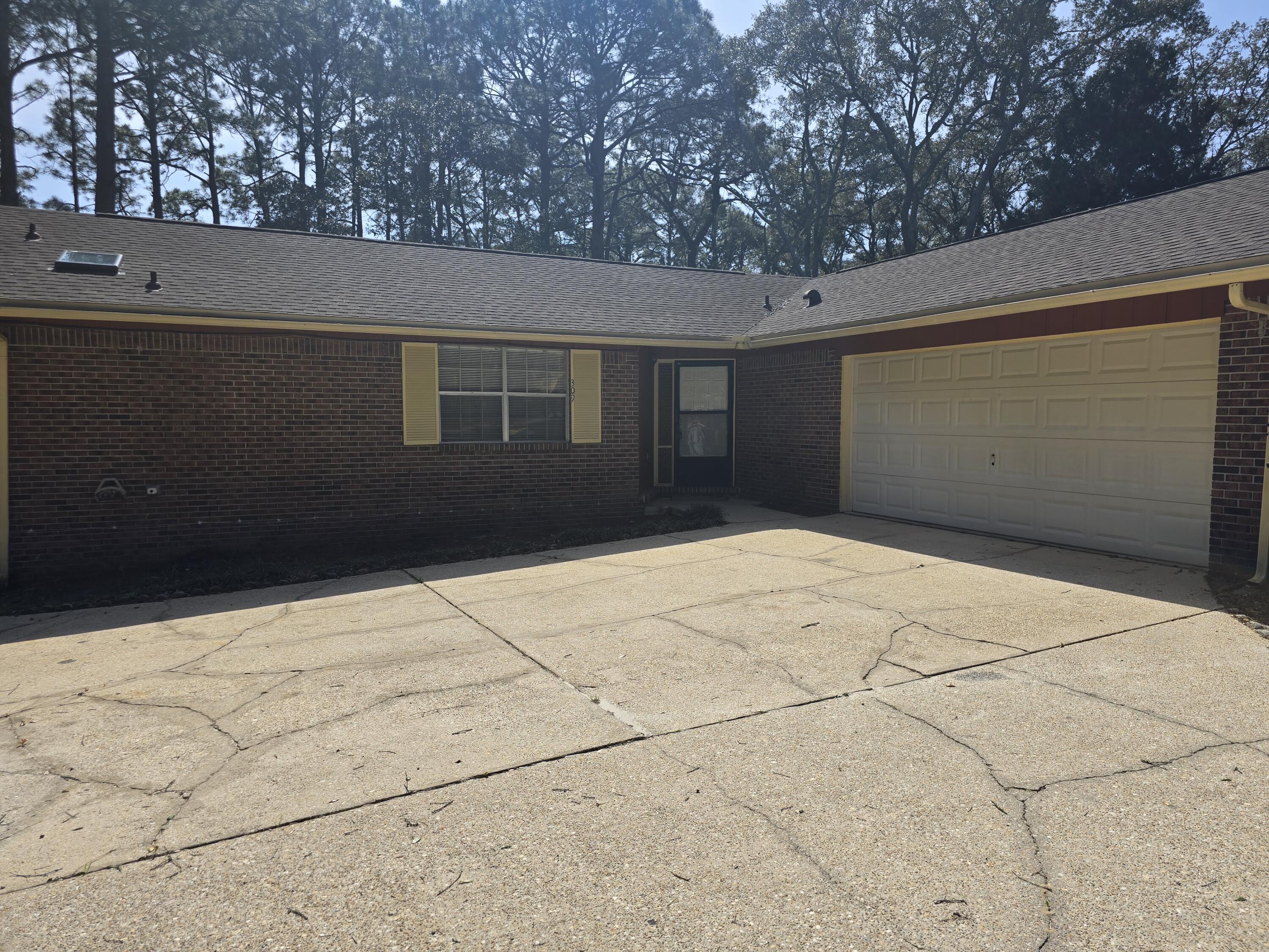 Great Home located conveniently in Ft Walton Beach. Plenty of room with a living room, dining room, and a family room with a fireplace. Freshly Painted. New Roof.  No pets allowed. House has a separate laundry room and Oversized 2 car garage. Large deck off the back. Tile flooring in the living room, dining room, den and baths and new carpet in the bedrooms. Some updates in kitchen and baths. Come take a look at today. Very convenient to everything in FWB including beaches and both bases. Large back yard and Deck perfect for your entertaining