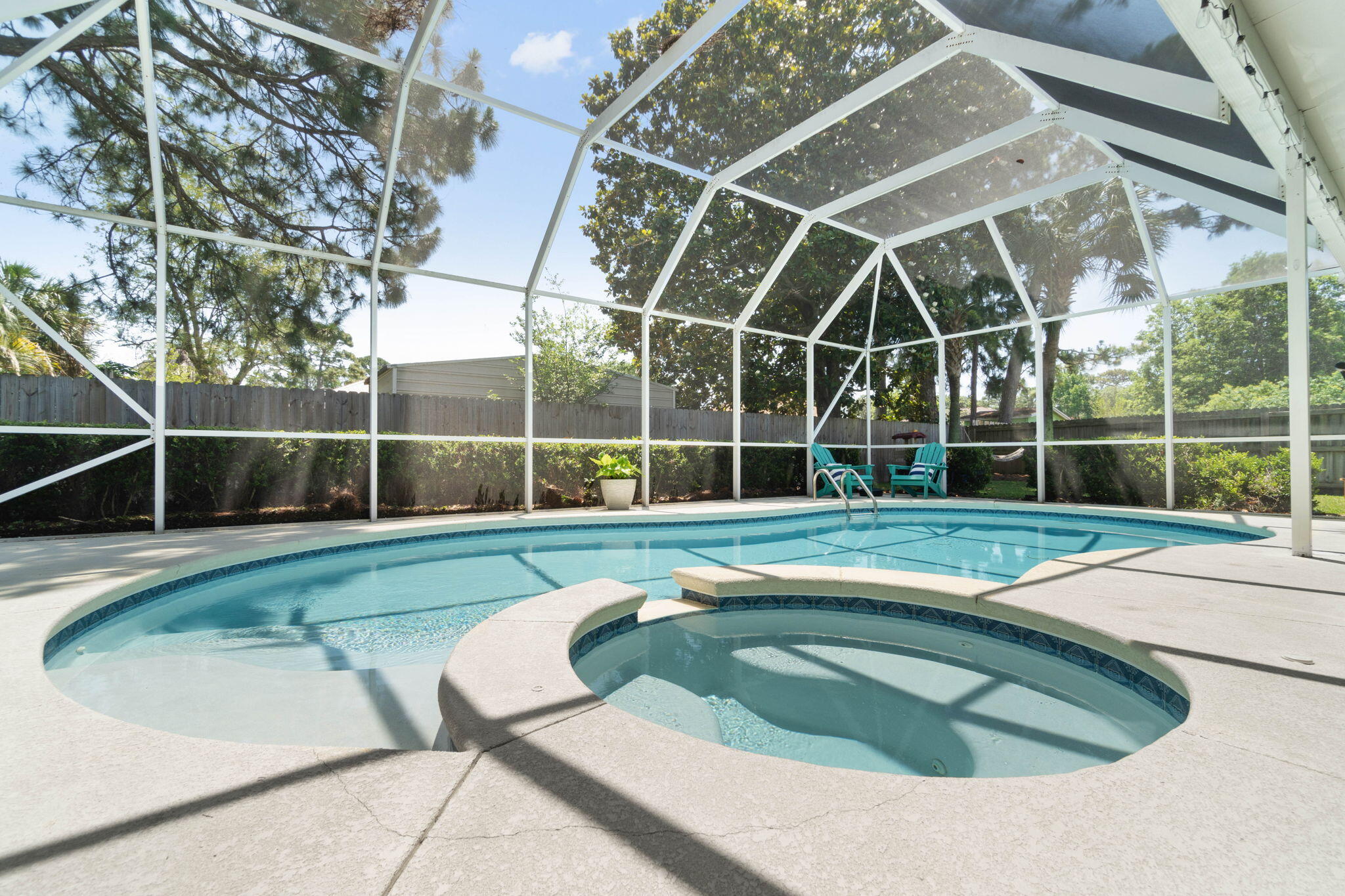 Welcome to this truly one of a kind cul-de-sac Bluewater Bay area (heated) saltwater POOL home with a garage studio apartment with almost 3000sqft in Raintree Estates! Want to bring your cars, boat, AND water toys? No problem, here you'll find two garages that fit up to 5 cars plus a long driveway to fit 6! One of the garages even has its own separate bathroom (in addition to the other 3 bathrooms) perfect for a workshop or a great place to wash your dog and the 60 gallon professional air compressor and Generac whole home generator will convey! But wait, there's more! Past the inviting massive front porch, downstairs you'll find 3 bedrooms and 2 bathrooms in a split floor plan plus an office and a formal dining room AND upstairs above the 3 car garage you'll find a studio apartment with a kitchenette and a full bathroom! The spacious master bedroom features an en suite with two walk in closets with custom closet organizers, double vanities, a stand up shower, jetted tub, and a private water closet with a toilet and bidet! The other two bedrooms are on the other side of the house with ample closet space and a shared full bathroom. As if it couldn't get better, enjoy the best of Florida living in your fully enclosed pool deck within the fully fenced in backyard complete with an irrigation system. Relax on your covered back patio, grill out at the outdoor kitchen, or enjoy the hot tub after a long day. To top it off you can enjoy the heated salt water pool all year long (heated by natural gas)! There is a voluntary HOA for $175/year where you can enjoy two neighborhood parks that feature a baseball and soccer field, nature trails, playground, pavilion, and waterfront area featuring a dock. Be sure to come tour this unique gem perfectly located near shopping, dining, boat launch, and Niceville schools. Be sure to check out the list of items to convey. Have peace of mind with a termite bond for preventative treatment and protection! Roof (May 2021), water heater (April 2021), HVAC (2014) Property survey available for buyer's use.