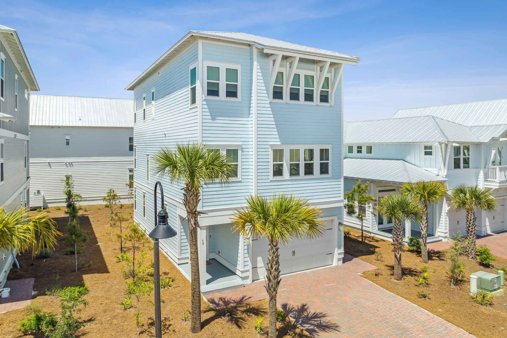 This coastal retreat is a beautifully decorated and well-crafted home, perfect for those who appreciate Southern living and beachside relaxation. The home's features, including shiplap and crown molding, 8ft doors, and 10ft ceilings, suggest attention to detail and high-quality craftsmanship. The large windows and porches on all three levels offer plenty of natural light and opportunities to enjoy the beautiful views. Additionally, the elevator provides easy accessibility to all three floors, making it an ideal home for those who require or prefer mobility assistance.

This 4-bedroom beach house has two master suites, one on the first floor and one on the third floor, offering flexibility and privacy for residents or guests. The Chef Inspired kitchen and expansive Great Room are perfect for hosting gatherings of friends and family. The home is also offered fully furnished, making it move-in ready and convenient for those who prefer not to worry about furniture and decor.

The Prominence community offers many amenities, including resort-style pools, a fitness center, and a shuttle service to the nearby Deer Lake Park Beach Access. The location of the home is ideal for those who enjoy dining out, shopping, and entertainment, as it is within walking distance of The Hub, a popular destination for all of these activities. Additionally, the home is just a short walk from the members-only Watersound Beach Club, making it an excellent choice for those who value access to exclusive amenities.