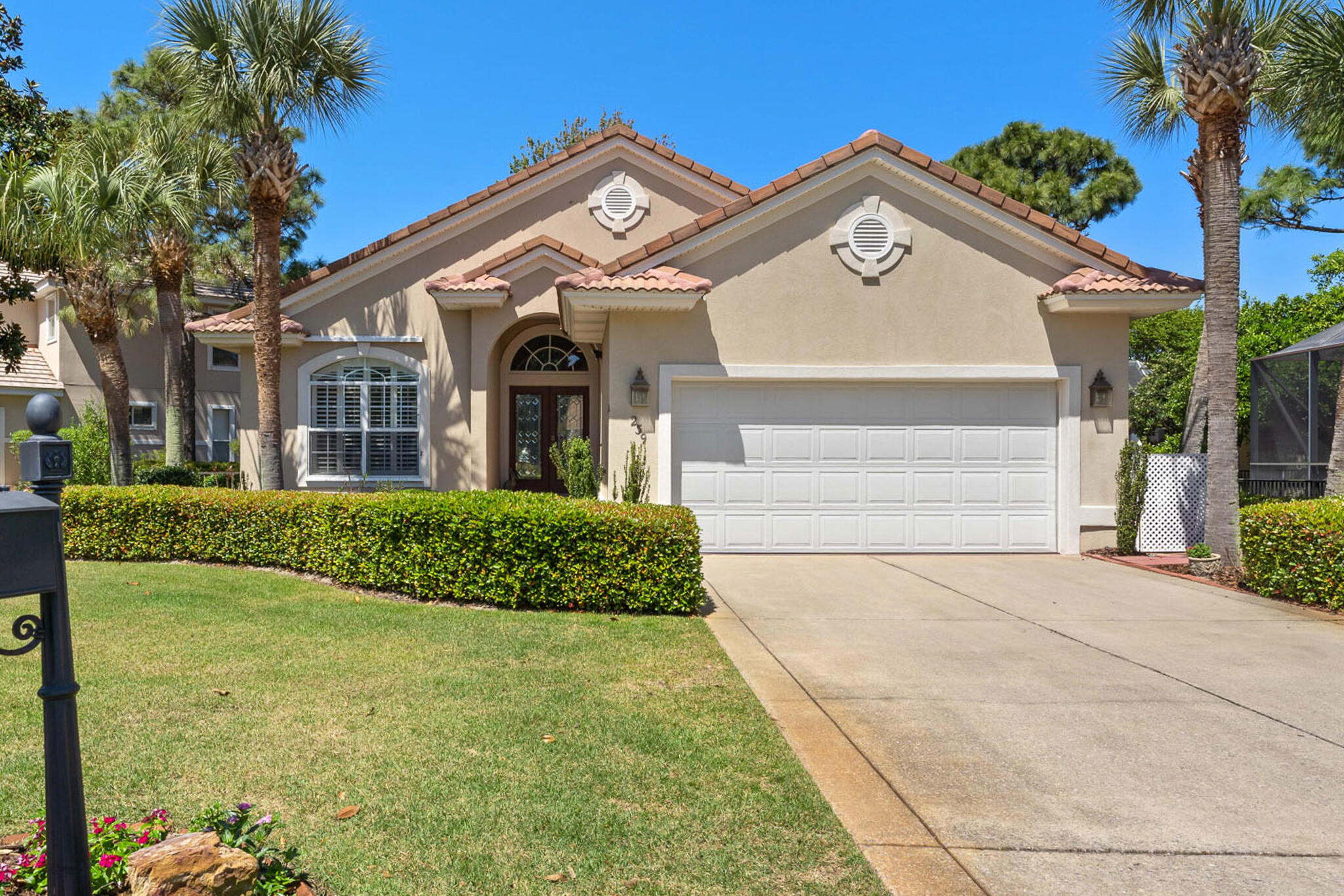 Beautiful lake-front contemporary home with 3 bedrooms and 2 bathrooms with gorgeous curb appeal. The private screened in back porch is accessible through large double sliding glass doors that are located directly off the dining room area. It is the perfect place to sit and relax after a day at the beach.  You can see the lake straight from the kitchen all the way through to the water.  This custom-built home is in a gated community and has been continuously updated since 2017 with heated flooring and a stand-alone shower with rain glass which brings a luxurious feel to the master ensuite. Soft-close cabinetry, quartz countertops, a gas stove, gas fireplace, ten-foot ceilings and canned lighting brings the elegance of this home to the next level. On the outside of the home, a tile roof, new landscaping, and metal hurricane shutters have been provided to match the meticulous details of the inside features. For all cooks, a very large food pantry supports proper storage for groceries. Two extra bedrooms perfect for guest, office space, or children's rooms are supported by an easily accessible fully tiled bathroom with rain glass as well.  Come join us for the Open House on May 1st from 12-3 p.m.  All information deemed to be correct, but any information important to buyer must be verified.
