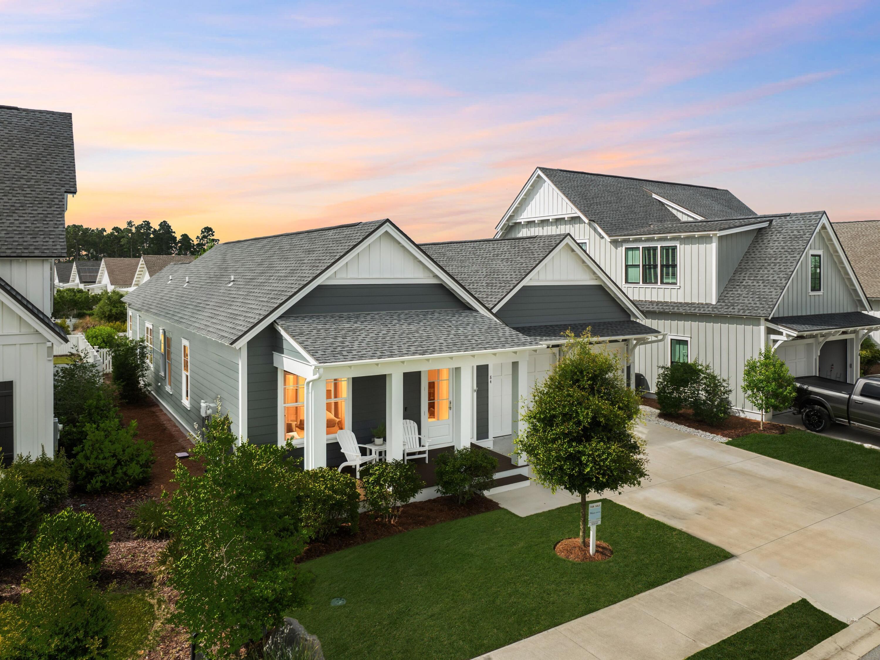 Lowest Priced Romair-Built Home in all of Watersound Origins! 

Situated on a premium lot with community greenspace directly behind, this newer construction lakeside residence is in the sought-after community of Stillwater at Watersound Origins. Beautifully constructed to the highest standards by Romair Homes, it boasts multiple upgrades and fine finishes that stand the test of time. Beyond the open front porch, light oak-engineered wood flooring leads the way into the open concept home, which is both light and spacious. Your eyes are immediately drawn to the upgraded nano wall that fully opens to extend the living space into the spacious screened porch - ideal for those who enjoy entertaining.  Relax and enjoy a tranquil cup of coffee with views across the backyard to a picturesque pond that provides exceptional privacy and serenity. It's a calming view that never grows old. 

Elevated landscaping and an automated irrigation system keep the yard looking its best, even when owners are absent. The living room features a dedicated dining area adjacent to the gourmet kitchen. White soft-close cabinets, cool quartz countertops, and a pantry enhance this practical space, along with top-of-the-range Bosch appliances, including a 36-inch gas range. The central island has ample space for four stools, making it perfect for serving pre-dinner drinks and snacks. All on one level, this upscale Florida cottage has three stunning bedrooms and three pristine bathrooms. The master bathroom has a vanity with dual sinks, a frameless glass shower, porcelain tile, and a stunning oval tub for bubbly soaks. A two-car garage provides ample space for vehicles and beach toys. 

Days can be spent playing tennis, pickleball, and golf, or shopping and dining in the vibrant town center. Community pools are scattered throughout this well-maintained neighborhood. Five miles of walking trails are perfect for bicycle rides or leisurely strolls to the Village Commons and neighboring Conservation Park. The coastal communities of Alys and Rosemary Beaches provide additional opportunities for alfresco dining and entertainment, making this the ideal location for a primary or vacation home close to stunning gulf beaches.