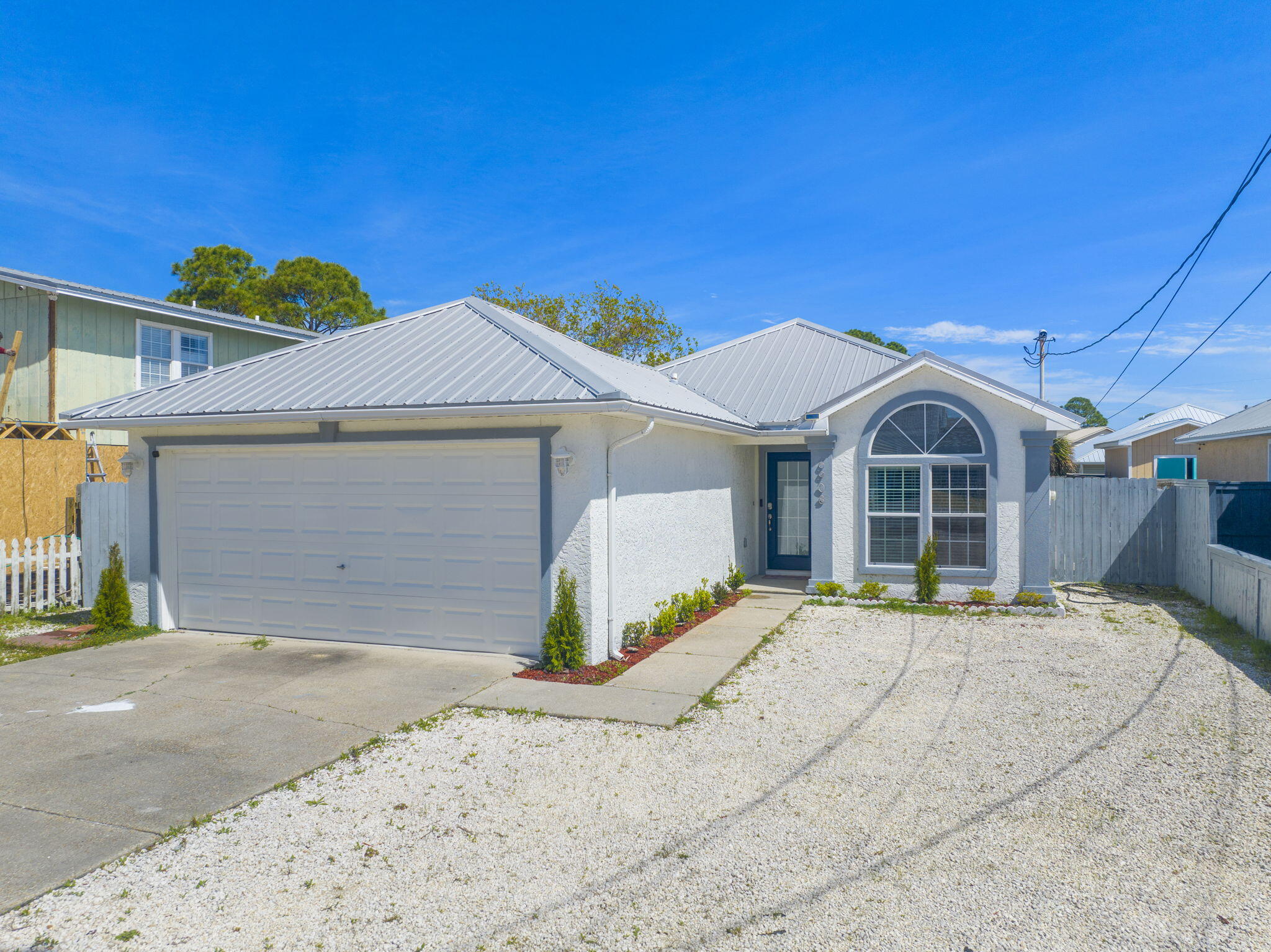 HIGH-DEMAND LOCATION MEETS TURN-KEY INCOME POTENTIAL with this short-term rental in Panama City Beach. This 3BR/2BA home offers 1,242 SF heated (1,846 SF total) with updated furnishings and appliances, allowing for immediate rental operation. Investor-friendly features include extra-large parking for multiple vehicles, a covered patio, outdoor fire-pit gathering area, and a large storage shed with potential for a game room or added guest amenity. JUST A 6-MINUTE WALK TO PUBLIC BEACH ACCESS 15, slightly over 11 minutes to M.B. Miller County Pier, and minutes to dining, shopping, and attractions, this property benefits from strong rental potential driven by walkable beach access and functional layout. Suitable for investors, second-home buyers, or full-time residents.