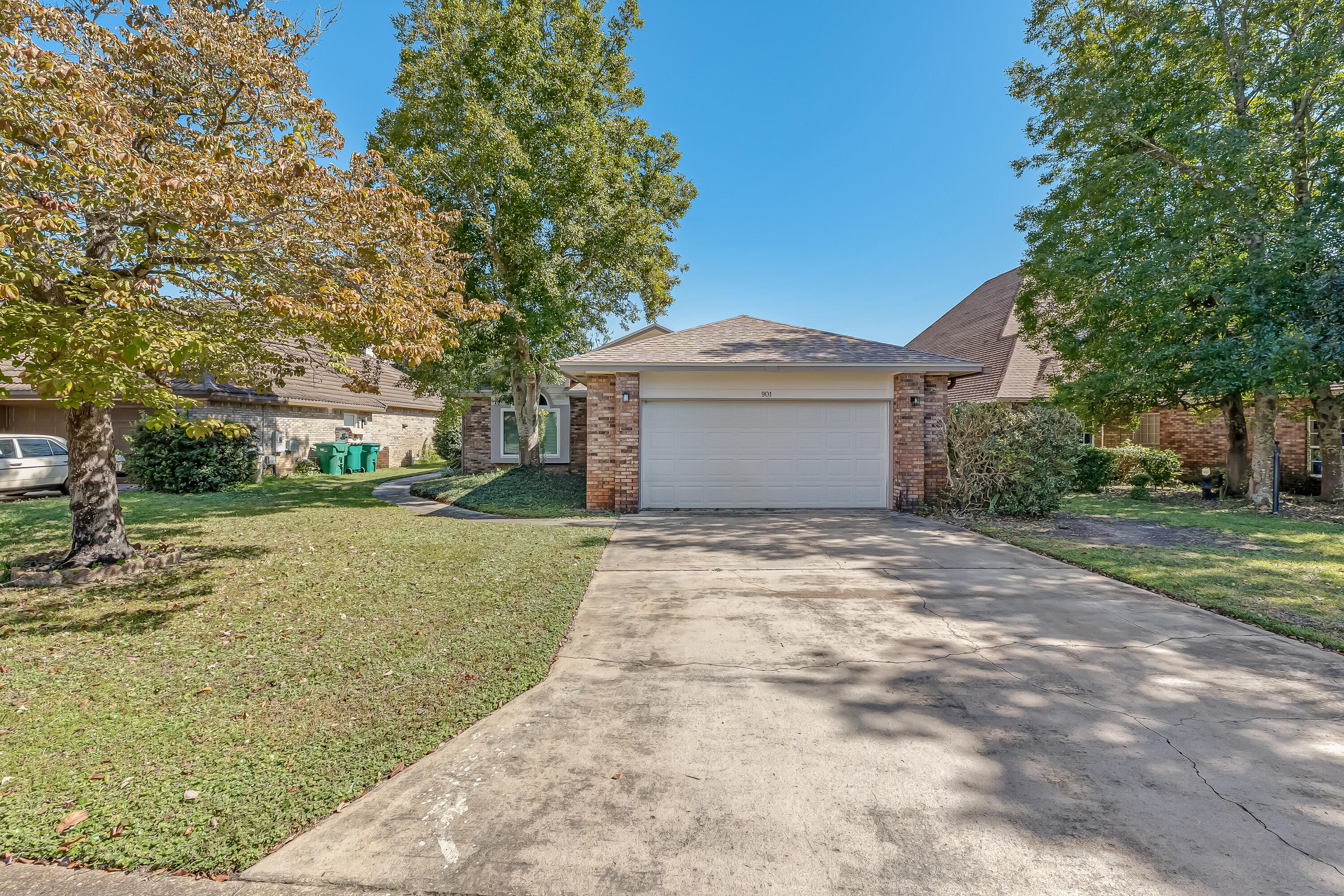 Fantastic location in the gated community of Shalimar Pointe. A recently renovated golf course. This immaculate and updated single-story brick home sits on the 9th fairway of Shalimar Pointe Golf Course and shows beautifully.

The home features wood laminate and tile flooring throughout for easy maintenance. The open kitchen includes a cathedral ceiling, pendant lighting, stainless steel appliances, and a raised breakfast bar. The bright dining area overlooks the golf course, and the spacious living room offers a fireplace and connects to both the living room and screened porch, ideal for entertaining or relaxing.

The primary bedroom has a vaulted ceiling, walk-in closet, and an updated bath with dual undermount sinks, marble countertop, and a custom-tiled shower. Updates since 2014 include: hurricane-impact windows, laminate wood flooring, kitchen appliances, custom blinds, front door, hot water heater, remodeled bathrooms, updated plumbing and lighting fixtures, ceiling fans, security system, interior paint, hardware, lawn sprinkler system, garage door opener, and landscaping.