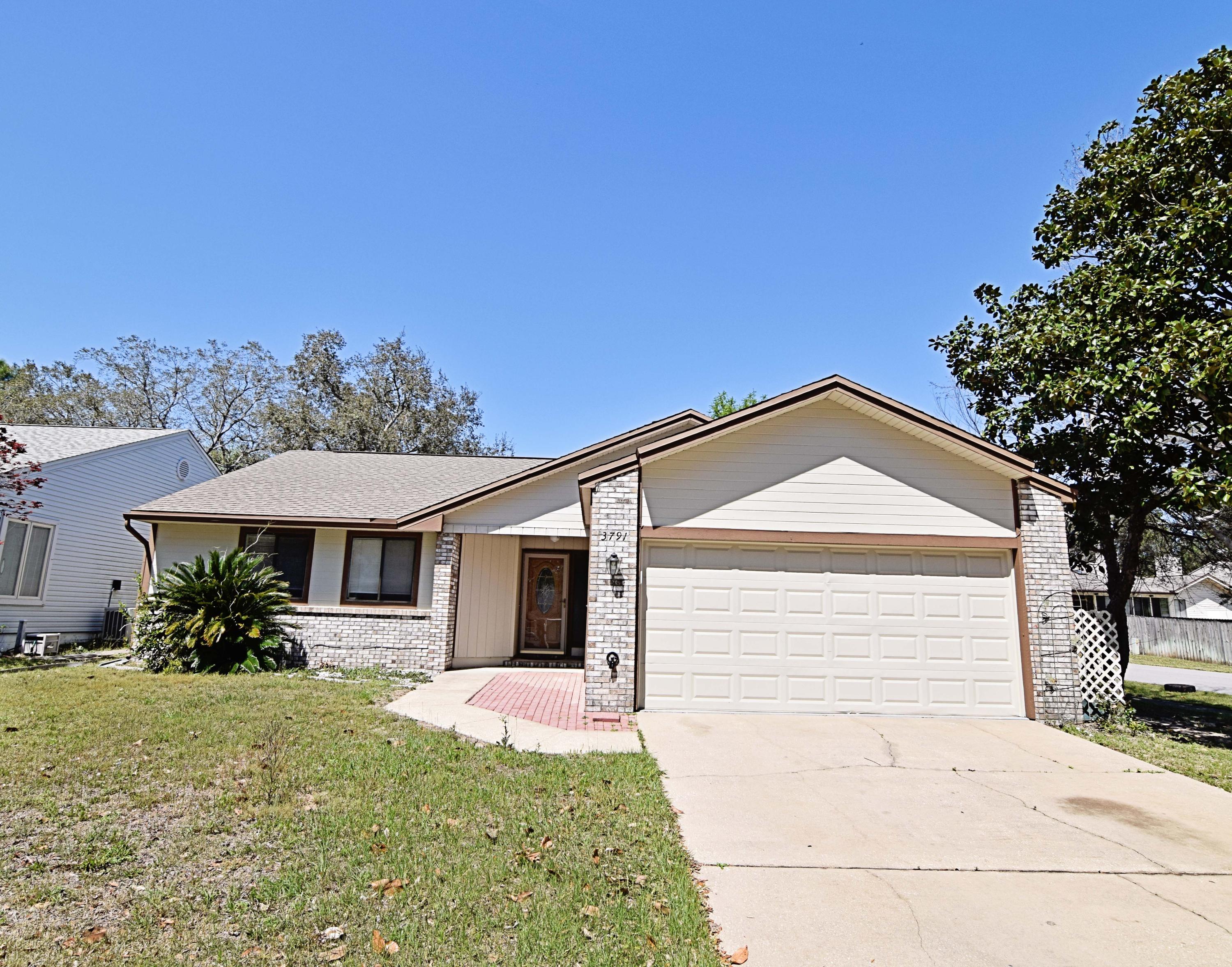 This home in is move in condition and ready for the next family!You will enjoy the large living room with the high vaulted ceiling and the beautiful brick fireplace, roomy enough for very large furniture. Open to the huge heated, cooled and tiled sunroom as well as the dining area, this home feels larger than the square footage shows. The kitchen is a cook's dream with fresh paint and granite and a beautiful backsplash. Newer stainless steel appliances include a 5 burner gas stovetop, oven, refrigerator and microwave. The master bedroom has a private bath and walk in closet. The additional 2 bedrooms share the hall bath. All bedrooms feature brand new carpeting. Stepping out of the sunroom to the outdoors, you will see the large patio perfect for summer grilling and entertaining.The fenced backyard is just the right size for kids and pets to play. All of this plus a 2 car garage and an extremely short commute to Eglin, this home won"t last long! Close to shopping, restaurants and the beautiful area beaches, please call to see this home today!