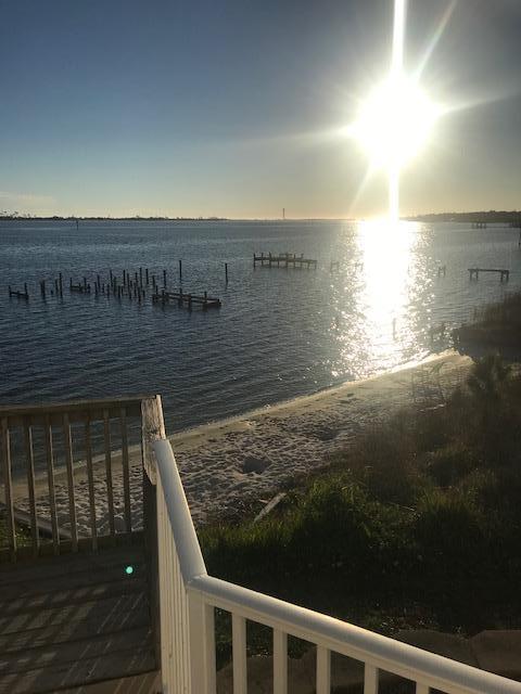 Just lowered price $200/month. Owner offering 6 month lease through the summer to the right tenant. Great opportunity to enjoy the beautiful waterfront location. Beautiful waterfront condo only 1 mile from Hurlburt Field. Renovated ground floor condo has new hard wood floors, several new appliances, large bedrooms, open floorplan kitchen and living room. Two large French doors display the stunning view over the Sound and community pool just off the private patio. Complex also has a small private beach just off the pool area. Don't come see this unit unless you are ready to move in, because you will fall in love and never want to leave.